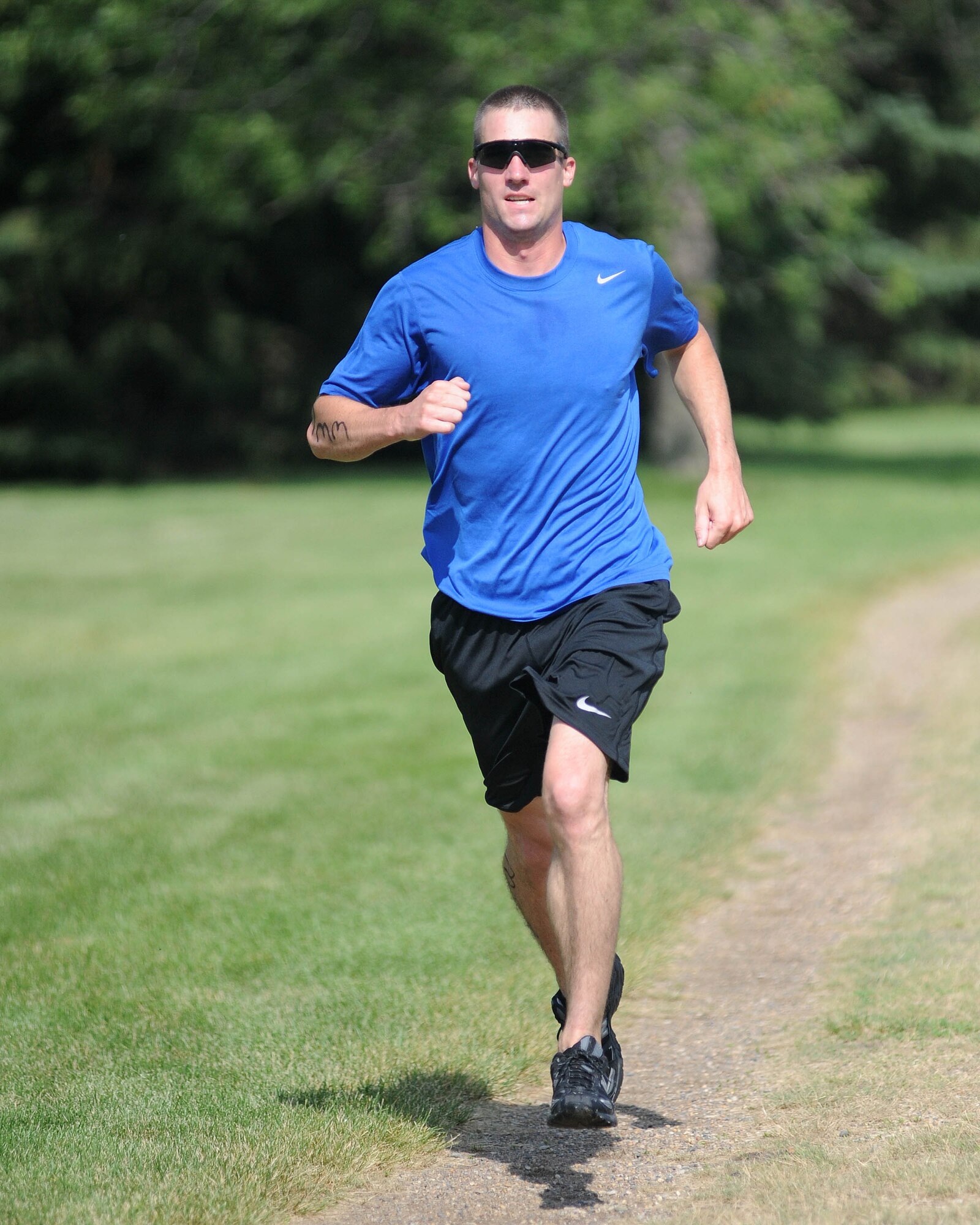 2nd Lt. Miles H. Ryan, 319th Civil Engineer Squadron, races toward the finish line July 17 during the 319th Air Refueling Wing’s 6th Annual Triathlon. Lieutenant Ryan placed first in his age category with a time of 1 hour, 13 minutes and 49 seconds. (U.S. Air Force photo by Tech. Sgt. Johnny L. Saldivar)