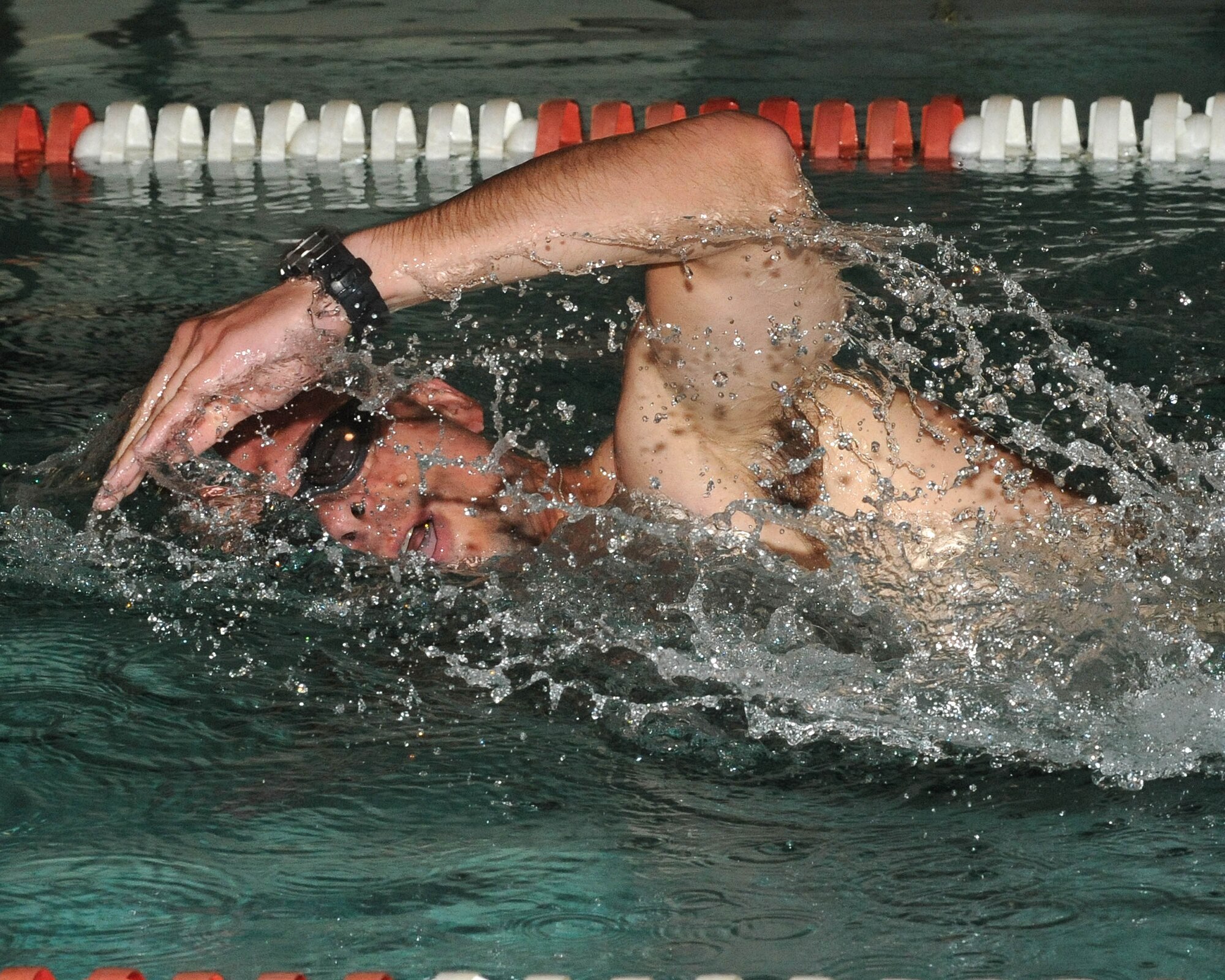 Capt. Ruben Oara, 905th Air Refueling Squadron, swims a few laps in the base pool July 17 during the 319th Air Refueling Wing’s 6th Annual Triathlon. Captain Oara placed first in his age category 1st place with a time of 1 hour, 21 minutes and 48 seconds. (U.S. Air Force photo by Tech. Sgt. Johnny L. Saldivar)