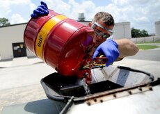 Staff Sgt. Mark Heitkamp dumps fuel samples into the reclaimable waste bowser behind the fuel pump house July 20, 2010 on Joint Base Charleston, S.C. Once the bowser is full, hydrants take the bowser to storage and pump it into the product recovery tank and the fuel is then pumped back into the fuel system for use. Sergeant Heitkamp is the noncommisioned office in charge of the fuels laboratory with the 628th Logistics Readiness Squadron. (U.S. Air Force photo/Senior Airman Timothy Taylor)
