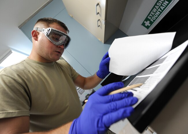 Staff Sgt. Mark Heitkamp prepares a fuel sample form to annotate the days tests on July 20, 2010 on Joint Base Charleston, S.C. Information noted from the days tests will then be transferred to their database for storing and reference. The fuel being tested is JP-8, a colorless sustance composed of a large number of chemicals that smells of kerosene. Sergeant Heitkamp is the noncommisioned office in charge of the fuels laboratory with the 628th Logistics Readiness Squadron. (U.S. Air Force photo/Senior Airman Timothy Taylor)