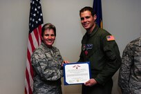 Staff Sgt. Matt Pardini is presented the Bronze Star Medal by Col. Martha Meeker for his exceptionally meritorious achievement in support of Operation Iraqi Freedom July 16, 2010, on Joint Base Charleston, S.C. Colonel Meeker is the commander of Joint Base Charleston. Sergeant Pardini is a videographer with the 1st Combat Camera Squadron. (U.S. Air Force photo/Senior Airman Tyler Placie)