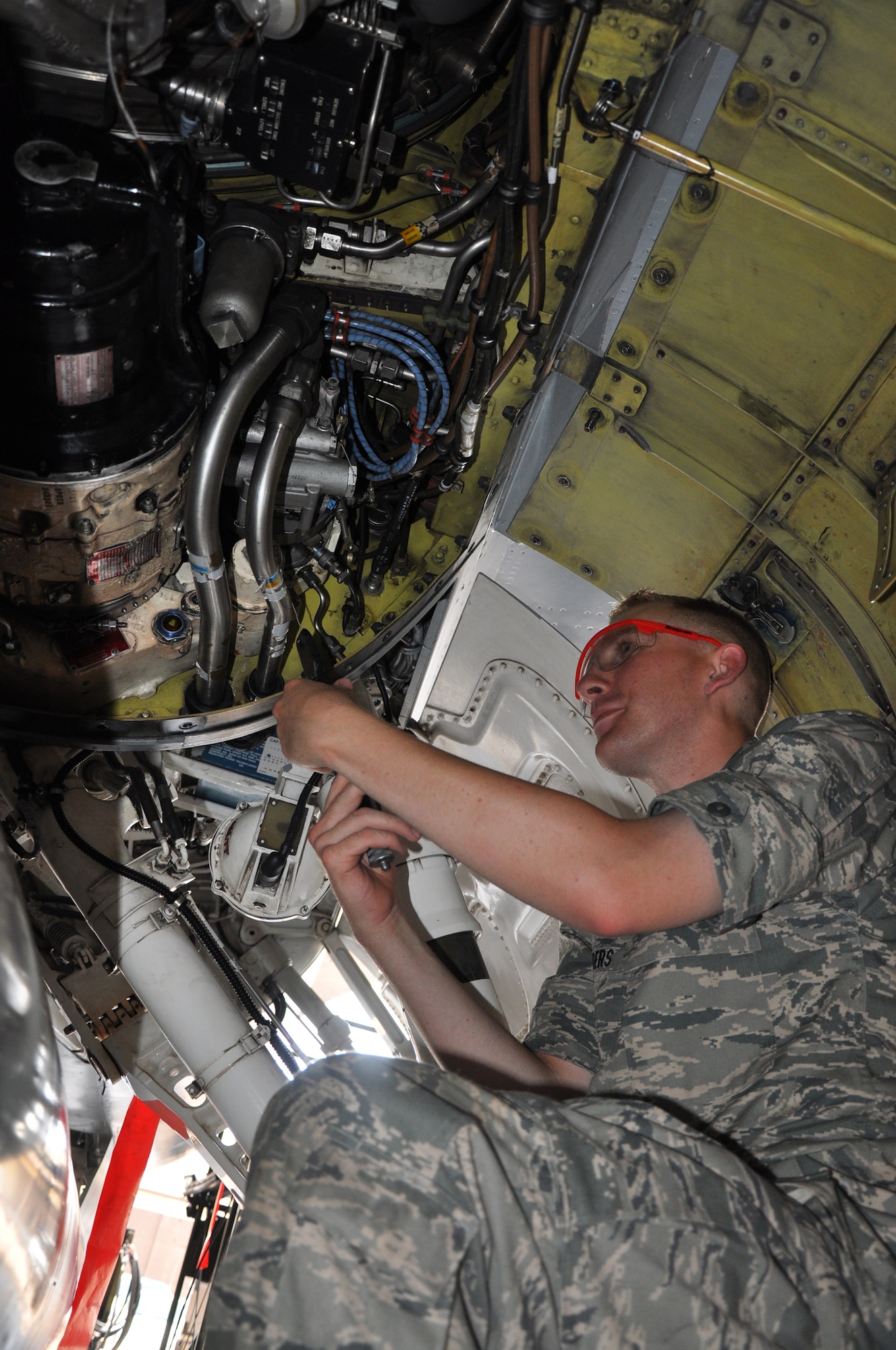 Airman Basic Michael Sanders practices a safety wiring procedure on an F-16 engine during the F-16 Aircraft Maintenance Apprentice Course in Hangar 1040 at Sheppard Air Force Base, Texas, July 16. Airman Sanders, F-16 aircraft maintenance student, said safety wiring is when a wire is used to secure a component after it has been torqued and tightened. The procedure ensures that if a part starts to come loose, the safety wiring will still secure the component. (U.S. Air Force photo/Tech. Sgt. Vernon Cunningham).