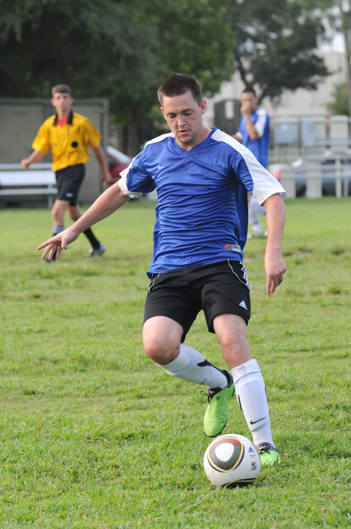 Craig Reinwald, 334th TRS, gains control of the ball to make a pass in Monday’s intramural contest against the 335th TRS.  (U.S. Air Force photo by Kemberly Groue)