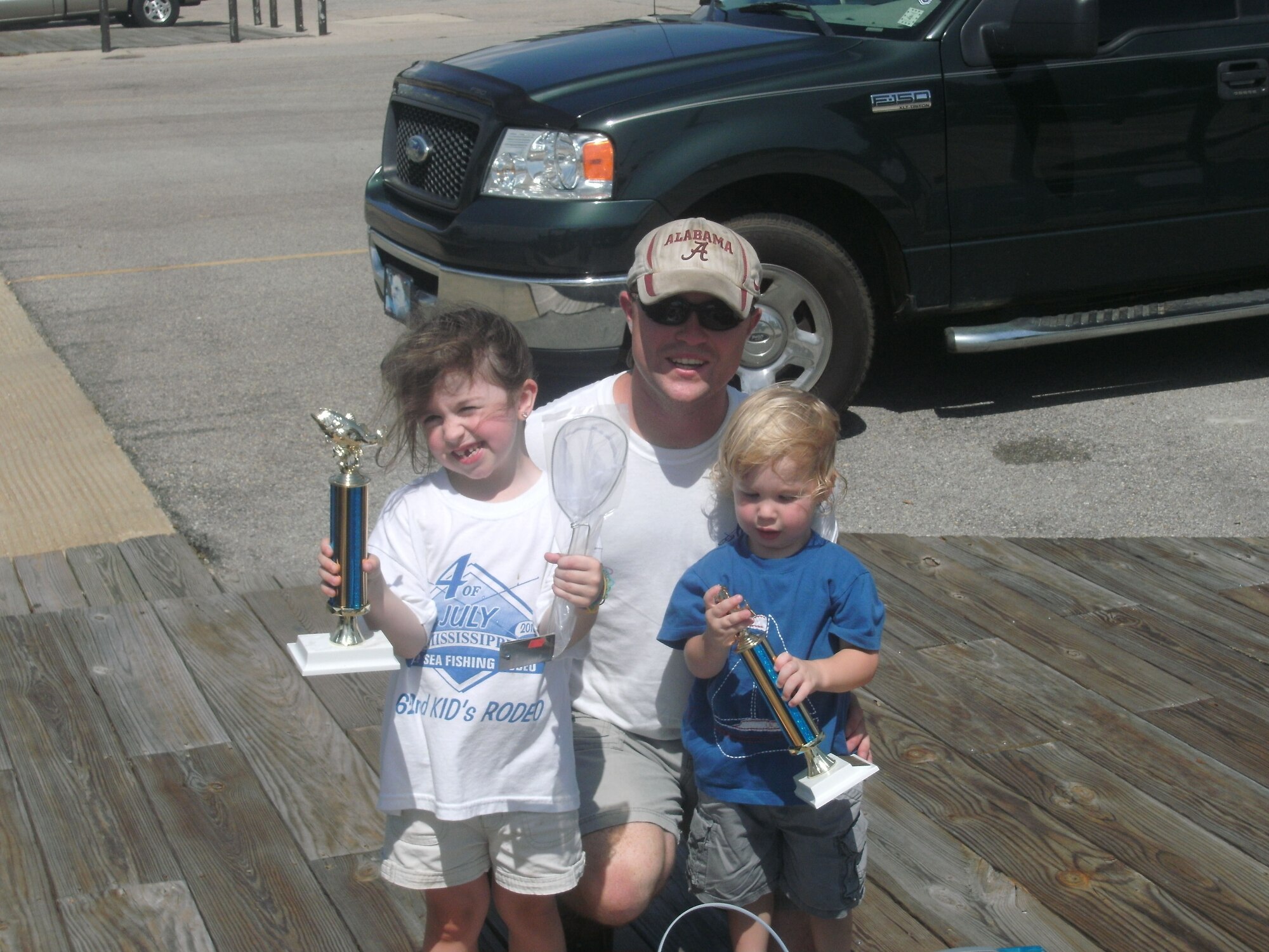 Hadley Thornton, 6, and her 2-year-old brother, Ethan, won first place in their divisions.  Their dad, Brian Thornton from the legal office, won first place in the flounder division earlier this month at the Mississippi Deep Sea Fishing Rodeo in Gulfport.  (Courtesy photo)
