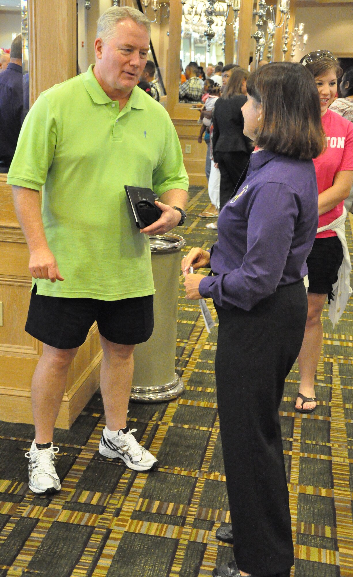 Col. William D. Stephens talks to Maj. Sarah McLevy before the Yellow Ribbon Reintegration event July 17-18 in Jacksonville, Fla. Col. Stephens is the 315th Mission Support Group commander and Maj. McLevy is the Florida National Guard, 927th Combat Sustainment Support Battalion deployment cycle support chief and Yellow Ribbon Program coordinator for the state of Florida. (U.S. Air Force Photo/Staff Sgt. Shane Ellis)