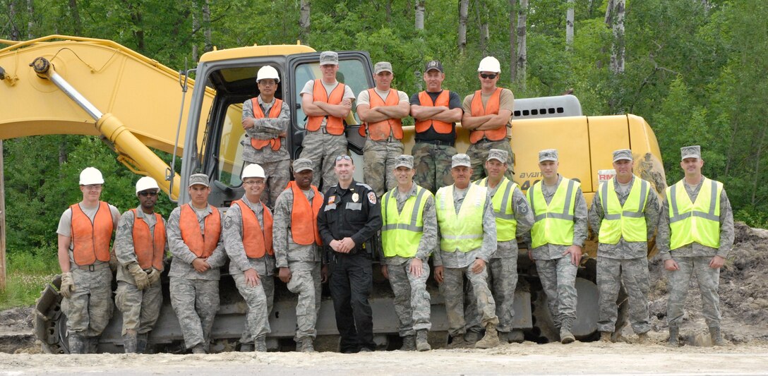 The individuals involved in the excavation project during the 940th Wing Commander’s visit June 30.  A member of the local police force was on hand for the visit.  The 940th CES  was involved in a humanitarian effort to improve the quality of life on the Red Lake Reservation. (U.S. Air Force Photo by Airman 1st Class Adam Hamar)