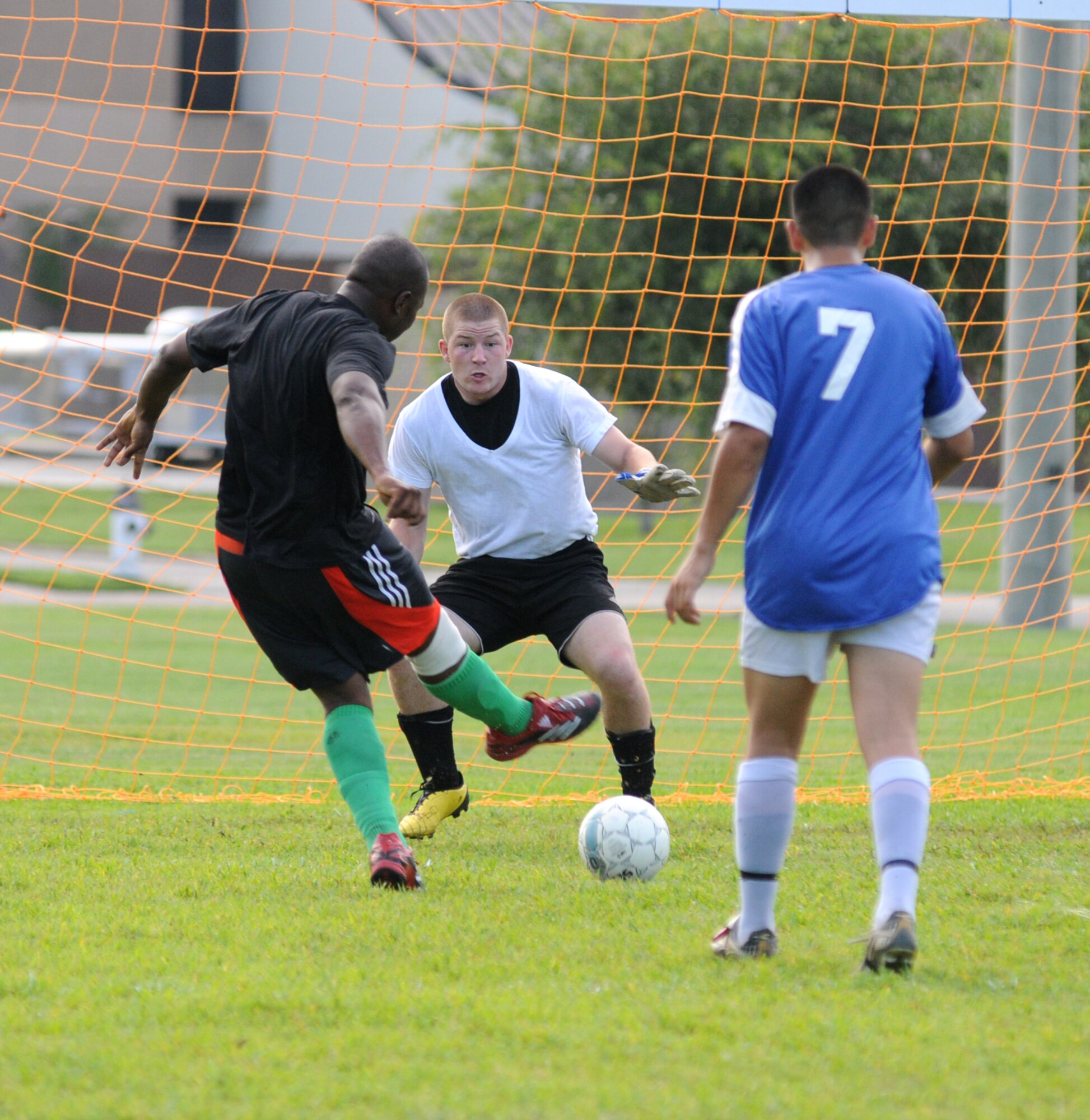 Mohamed Barry, 335th TRS, kicks the ball into the net past 334th TRS goalie Zane Stenz for the first point of one of Monday’s intramural soccer matches.  The 334th TRS claimed the win, 6-3.  This is the second week of the season.  The other nine teams are the 338th TRS-A, B and C teams; 336th TRS-A and B teams; 332nd TRS, 81st Logistics Readiness Squadron, 81st Medical Support Squadron and Center for Naval Aviation Technical Training Unit.  (U.S. Air Force photo by Kemberly Groue)
