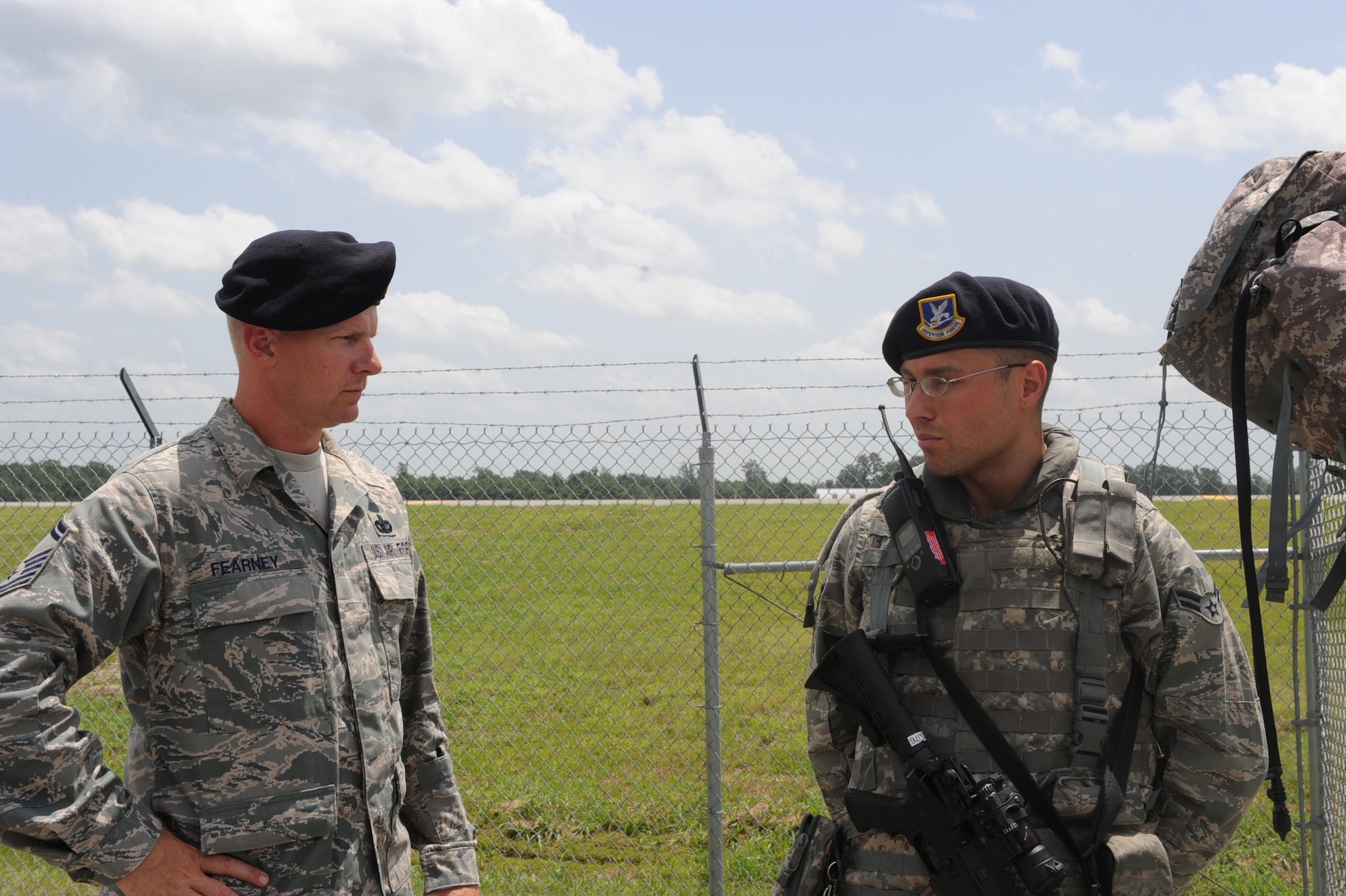 SEYMOUR JOHNSON AIR FORCE BASE, N.C. -- Senior Master Sgt. Timothy Fearney gives a post briefing to Airman 1st Class Landon Whitt during operational readiness exercise Coronet Warrior 10-04 here July 19, 2010. After assuming his post, Airman Whitt will provide security for the Airmen and assets located on the base flightline. Airman Whitt is a 4th Security Forces Squadron patrolman and Sergeant Fearney is the 4th SFS operations superintendent. (U.S. Air Force photo/Senior Airman Gino Reyes)