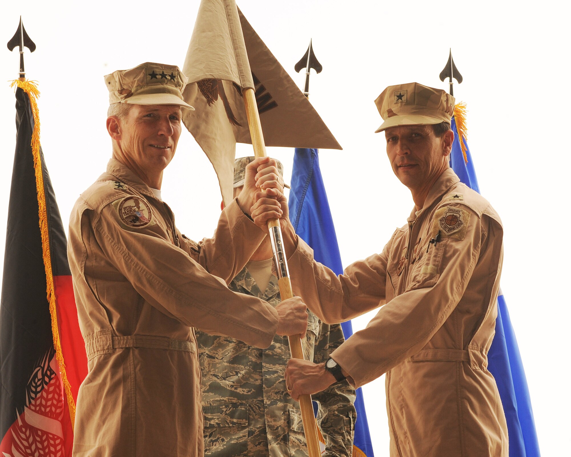 Brig. Gen. Paul Johnson assumes command of the 451st Air Expeditionary Wing from Lt. Gen. Mike Hostage, commander, Air Forces Central Command during a ceremony July 21 at Kandahar Air Wing, Kandahar Airfield, Afghanistan.
(U.S. Air Force photo by Staff Sgt. Chad Chisholm/Released)