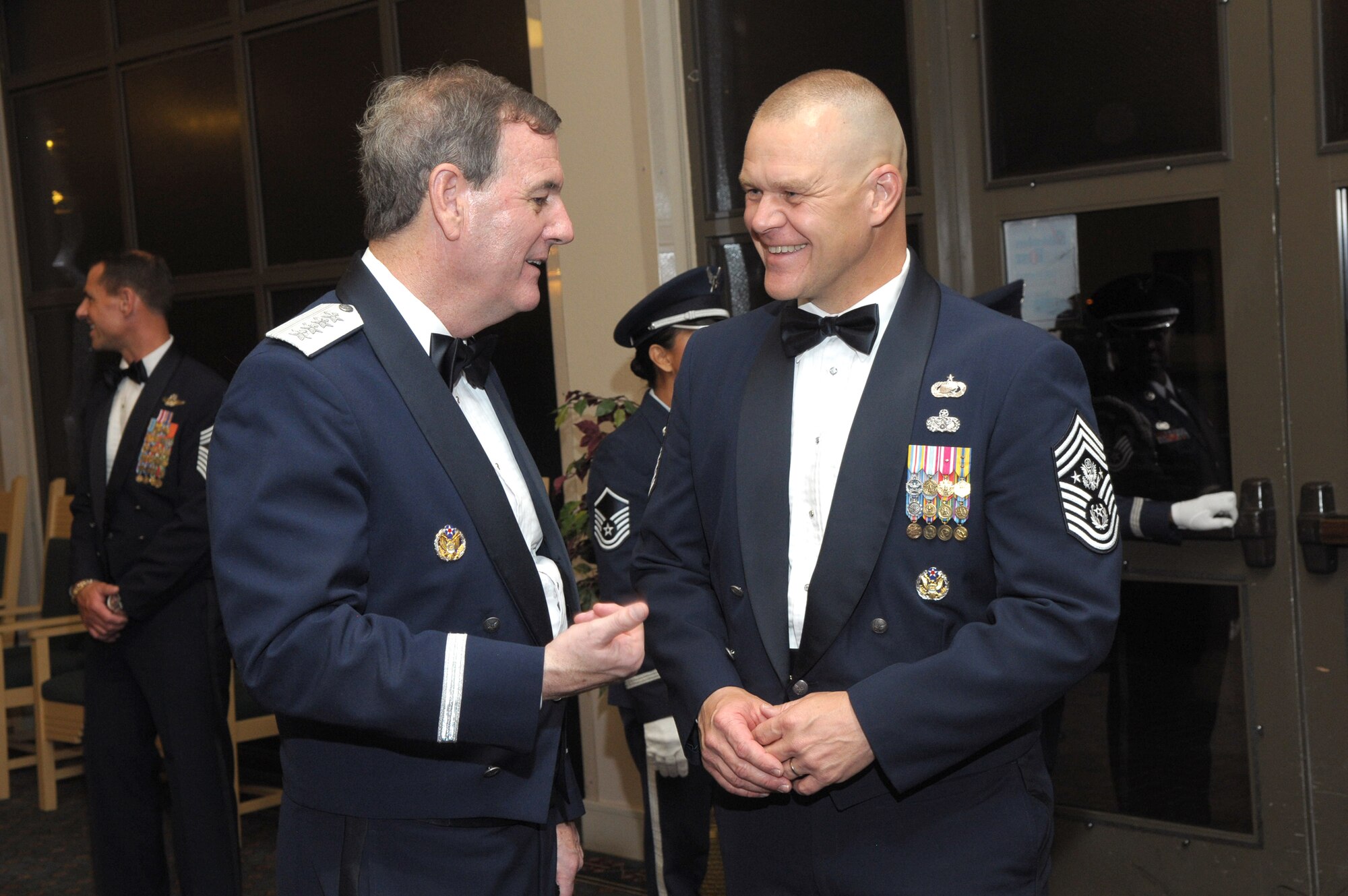 Gen. Stephen R. Lorenz talks with Chief Master Sgt. of the Air Force James A. Roy July 16, 2010 after his induction into the Order of the Sword at the Gateway Club on Lackland Air Force Base, Texas. General Lorenz is the Air Education and Training Command commander. (U.S. Air Force photo/Joel Martinez)