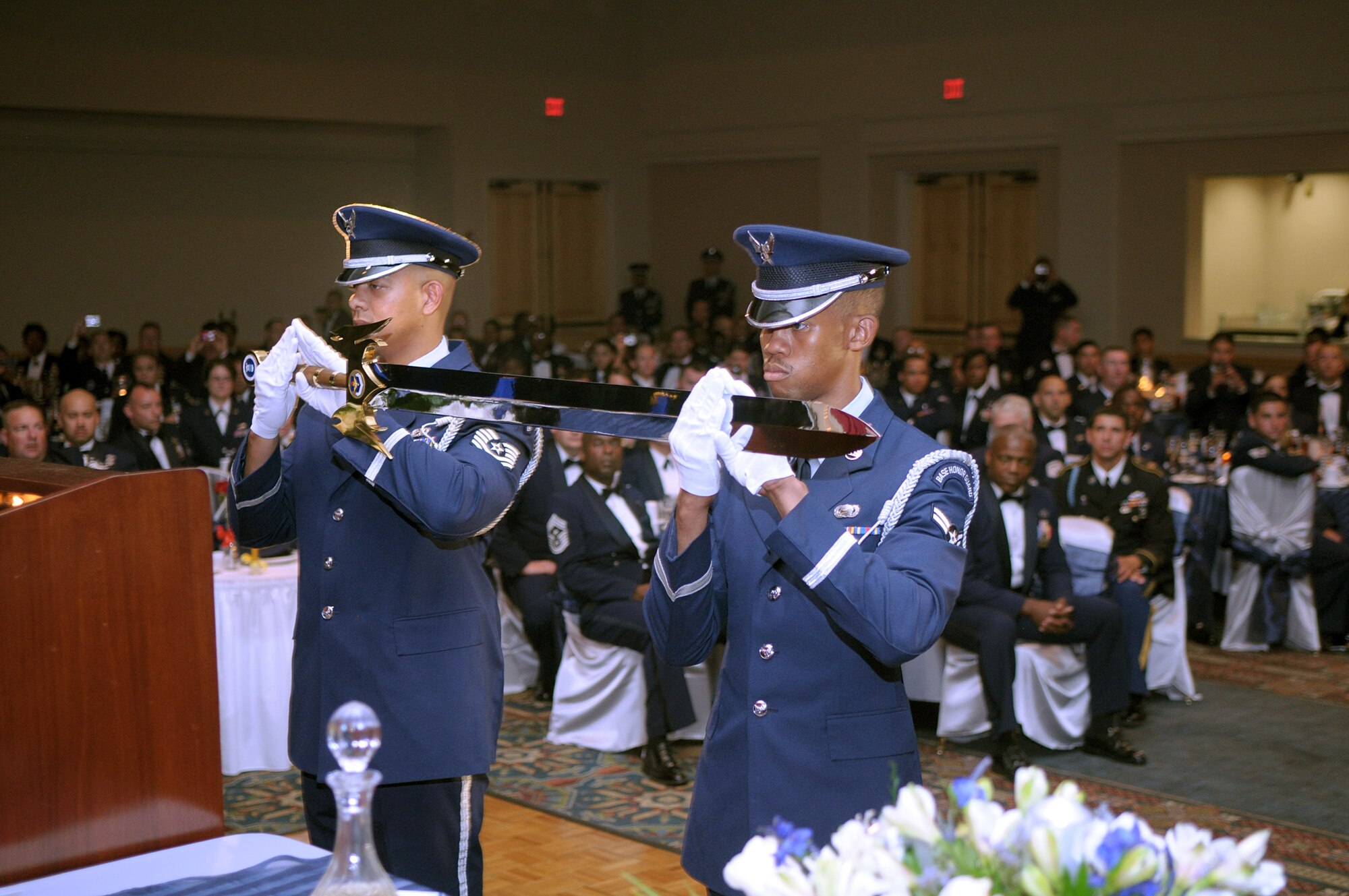 Air Education and Training Command honor guard Airmen, present the AETC command sword to the head table during Gen. Stephen R. Lorenz's Order of the Sword induction ceremony July 16, 2010 at the Gateway Club on Lackland Air Force Base, Texas. More than 300 Airmen from across AETC gathered to witness General Lorenz's induction into the Order of the Sword. General Lorenz is the Air Education and Training Command commander. (U.S. Air Force photo/Joel Martinez)