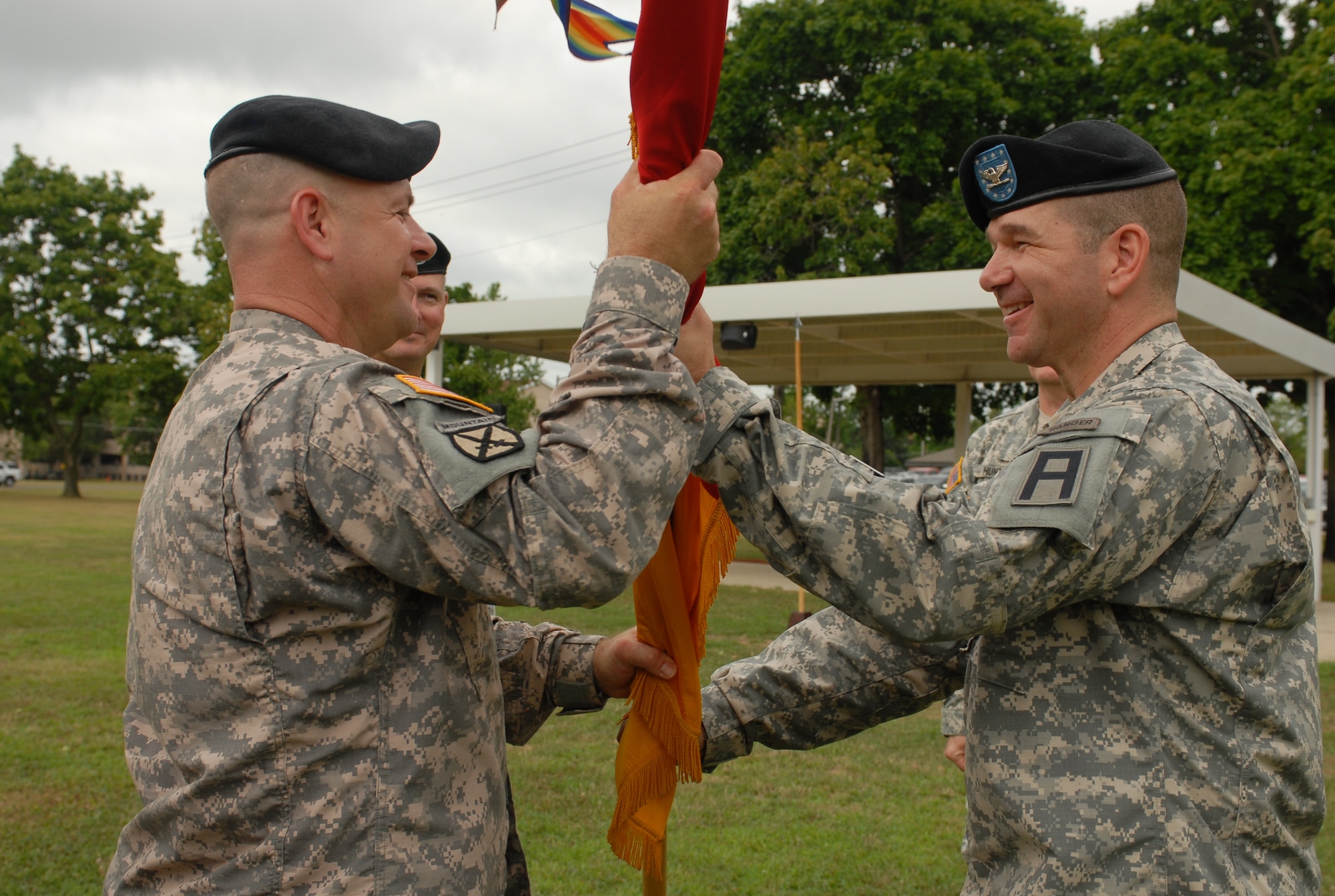 Col. Bert A. Ges (right), new commander of the 72nd Field Artillery Brigade, passes the unit colors to Command Sgt. Maj. James Herbert, during the brigade change of command ceremony July 16 at Joint Base McGuire-Dix-Lakehurst. (U.S. Army photo/ Sgt. Nicole Dykstra)