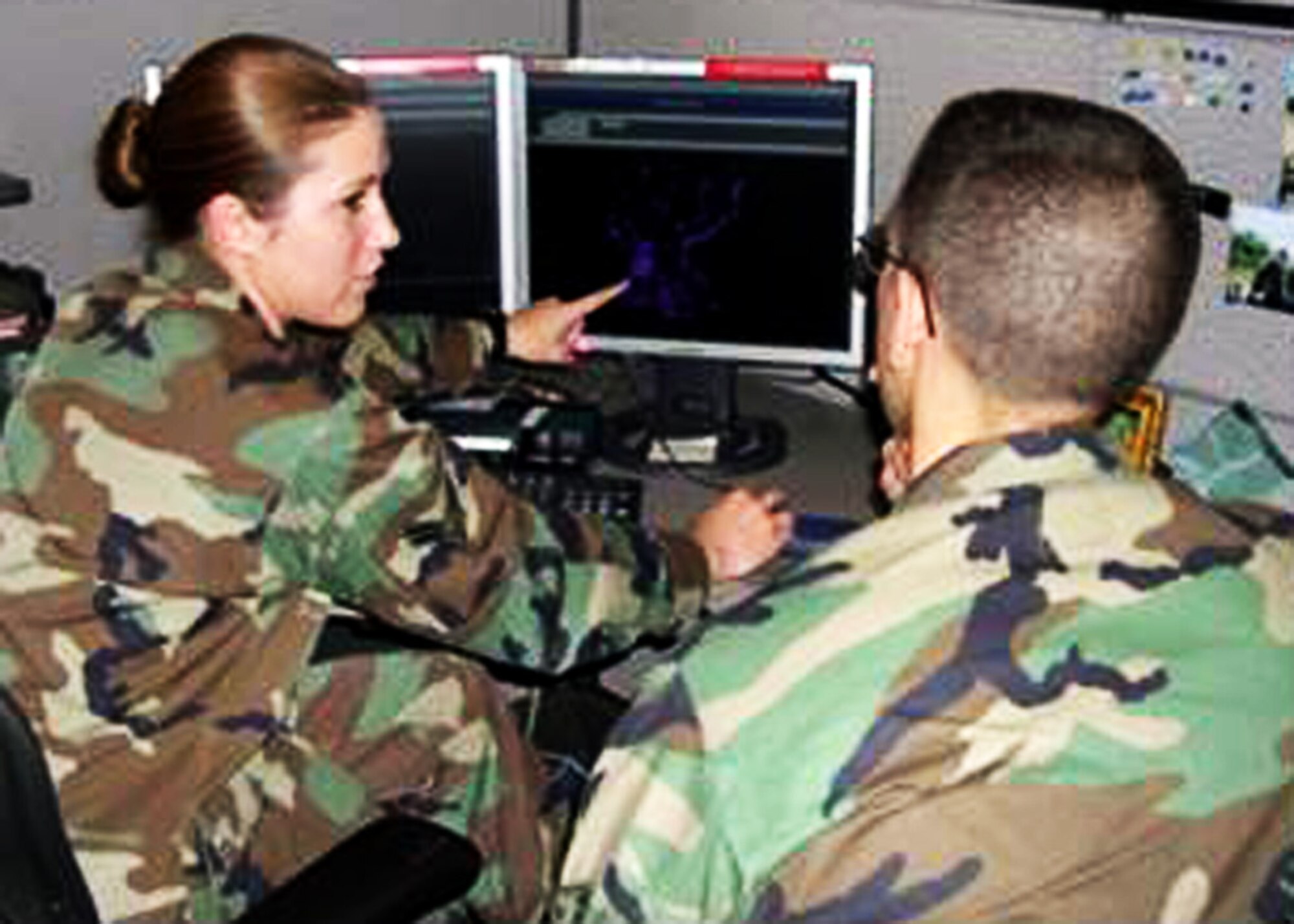 A senior analyst from the flagging flight trains a new analyst on how to detect anomalies in the signals that have been flagged. The flight is part of the 453rd Electronic Warfare Squadron. The squadron’s mission is providing timely, tailored and vigilant electronic warfare analysis and support down range to joint and coalition warfighters.  The squadron, located at Lackland Air Force Base, Texas, is part of the 53rd Wing headquartered at Eglin.  (Courtesy Photo)