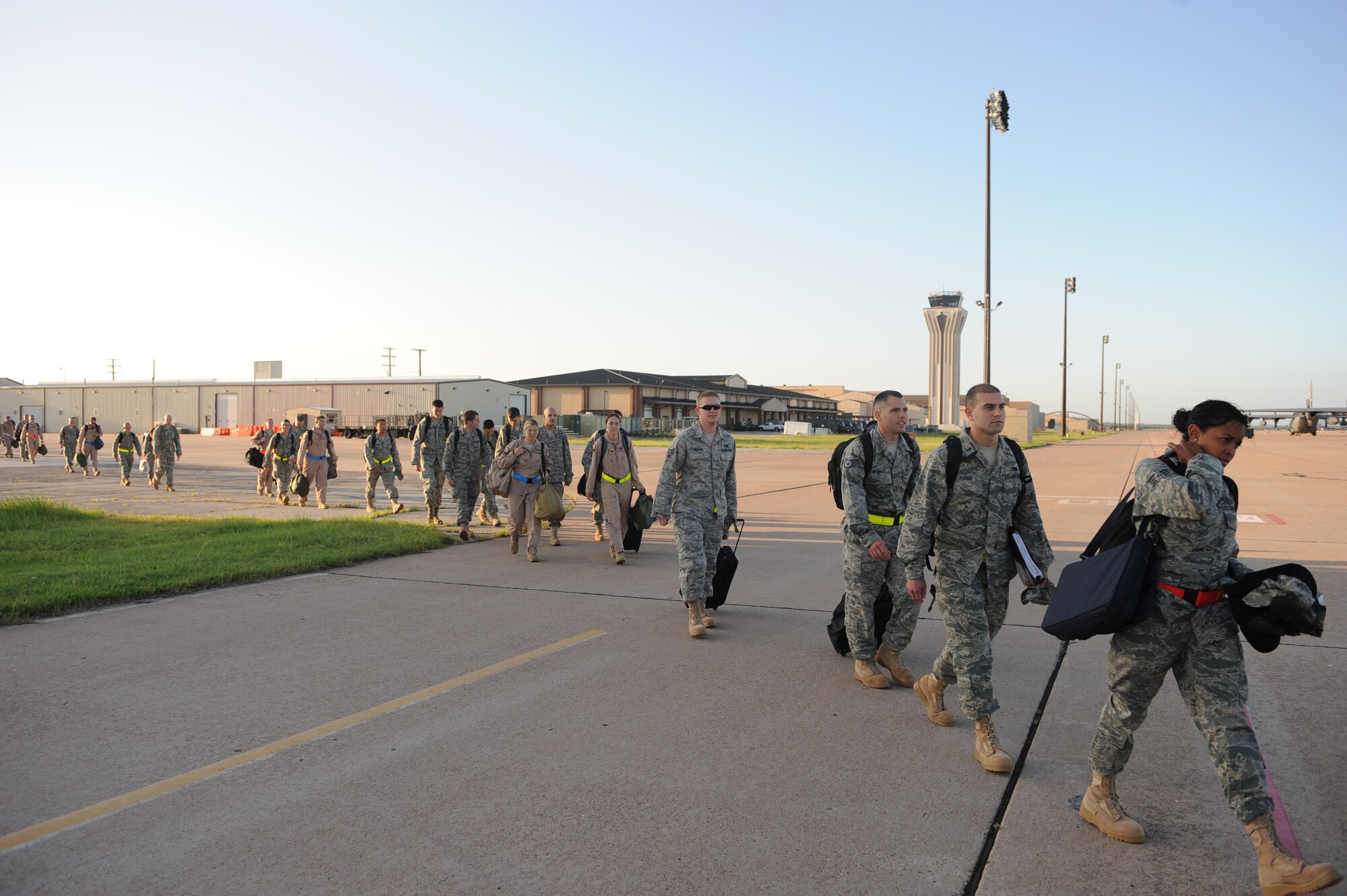 DYESS AIR FORCE BASE, Texas—Dyess Airmen from the 9th Bomb Squadron and 7th Maintenance Squadron prepare to board a plane to Southwest Asia here, June 20. The Airmen are going on a six-month deployment in support of Operation Enduring Freedom. There will be a total of 353 Dyess Airmen deploying from the 9th Bomb Squadron and 7th Maintenance Squadron throughout the upcoming week. (U.S Air Force photo/ Airman 1st Class Shannon Hall)