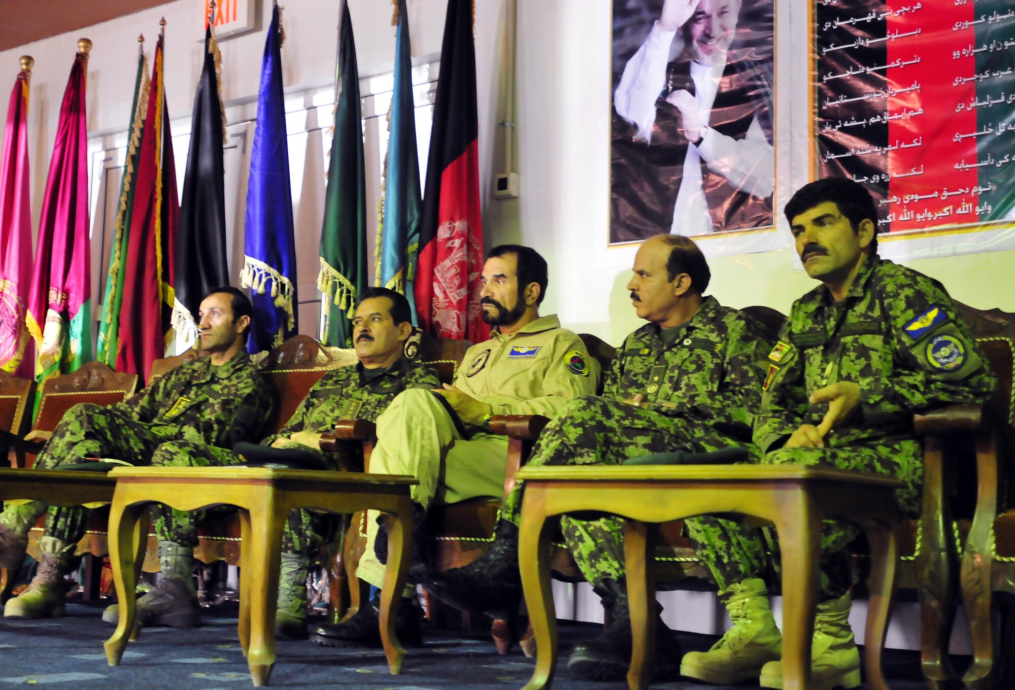 100721-N-6031Q-001 KABUL, Afghanistan - Maj. Gen. Abdul Sabour, Director of Intelligence for the Afghan  Air Force,  General Darwan, Commanding General, Afghan Air Force, Brig. Gen. Barat, Kabul Air Wing Commander, and other leadership witness the graduation of Airmen from the first Basic Intelligence Course designed and instructed by the Combine Air Power Transition Force. The course was conducted over a period of four months, with each graduate completing 210 hours of instruction which covered over 50 topics including mission planning, classified information protection, and critical thinking and analysis. (US Navy photo by Mass Communication Specialist 2nd Class David Quillen/ RELEASED).
