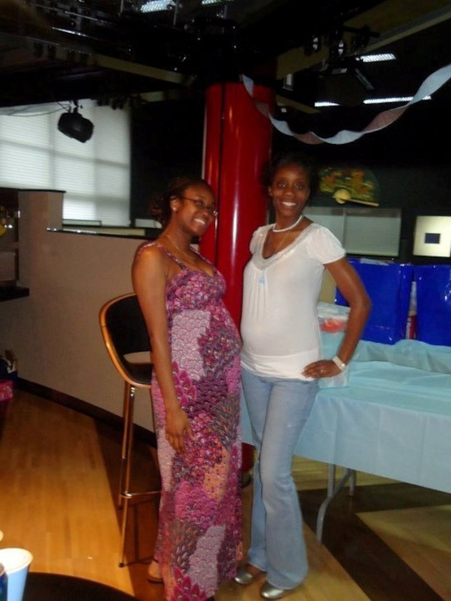 YOKOTA AIR BASE, Japan -- Senior Airman Semaj Everette poses with good friend Cainisha Fortner at her babyshower. Airman Everette is expecting her first child and has attended all of the classes Yokota has to offer for expectant mothers. (Courtesy photo)
