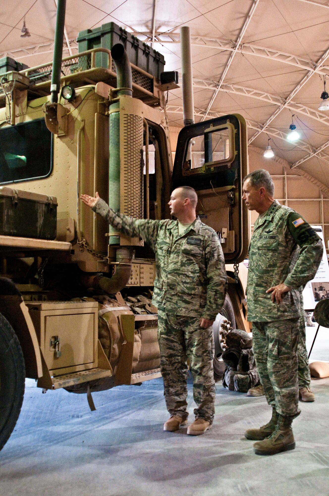SOUTHWEST ASIA - Tech. Sgt. Brandon Farley, a mechanic assigned to the 387th Expeditionary Logistics Readiness Squadron, briefs General William M. Fraser III, commander of Air Combat Command, on the capabilities of the M915A3P1 Maintenance Bobtail truck during a tour of the squadron at an undisclosed base here July 18, 2010. The only long-haul trucking unit in the U.S. Air Force, the 387th has moved more than 733,000 tons of cargo into and out of Iraq in the past year, covering over 13 million miles of dangerous roads. (U.S. Air Force photo by Maj. Dale Greer/Released)