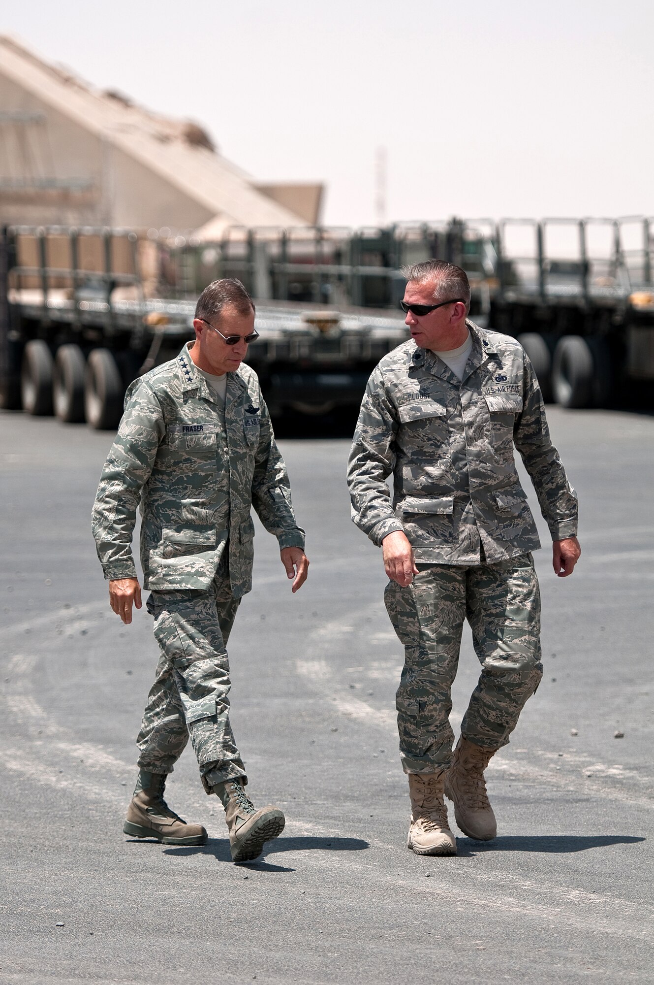 SOUTHWEST ASIA - Gen. William M. Fraser III, commander of Air Combat Command, receives a briefing on aerial port operations from Lt. Col. Gerald Clouse, commander of the 386th Expeditionary Logistics Readiness Squadron, during a tour of the 386th Air Expeditionary Wing at an undisclosed air base here July 18, 2010. The wing has airlifted more than 354,000 tons of cargo throughout the U.S. Central Command Area of Responsibility in the past year, directly supporting Operations Iraqi Freedom and Enduring Freedom. (U.S. Air Force photo by Maj. Dale Greer/Released)