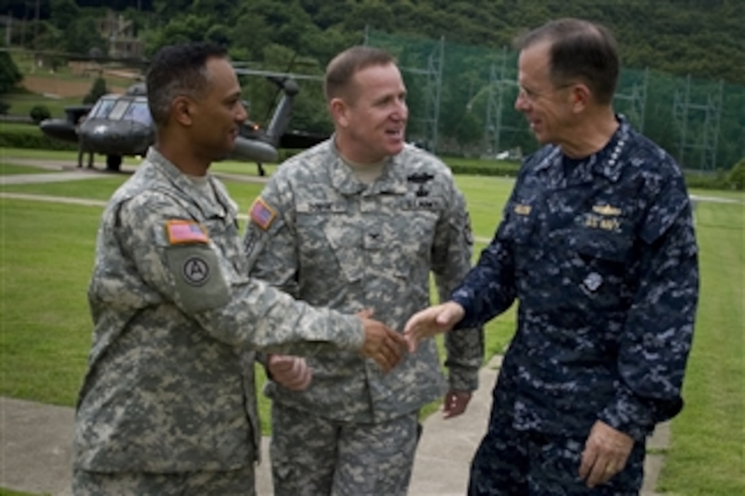 Chairman of the Joint Chiefs of Staff Adm. Mike Mullen, U.S. Navy, is greeted by the Commander of U.S. Army Garrison Red Cloud Col. Hank Dodge and Command Sergeant Major Nidal Saeed during a visit to the Republic of Korea on July 21, 2010.  Mullen met with 2nd Infantry Division soldiers assigned to the garrison located between Seoul and the demilitarized zone.  