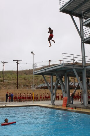 A Devil Pup recruit jumps from a 35-foot tower at Camp Pendleton’s 43 Area pool during the final training days of the first group for the 2010 Devil Pup program, July 22. The program is a nonprofit organization for teenagers, ages 14 to 17, teaches leadership, discipline and self confidence over a 10-day camp.