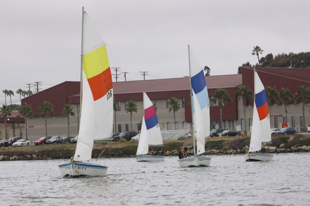 Sail boats fill the waters of Camp Del Mar Marina at Camp Pendleton, during a Youth Sailing and Kayaking course, July 21. In addition to the sailing classes for youths and adults, the marina boats a collection of watercraft for the enjoyment of base personnel.