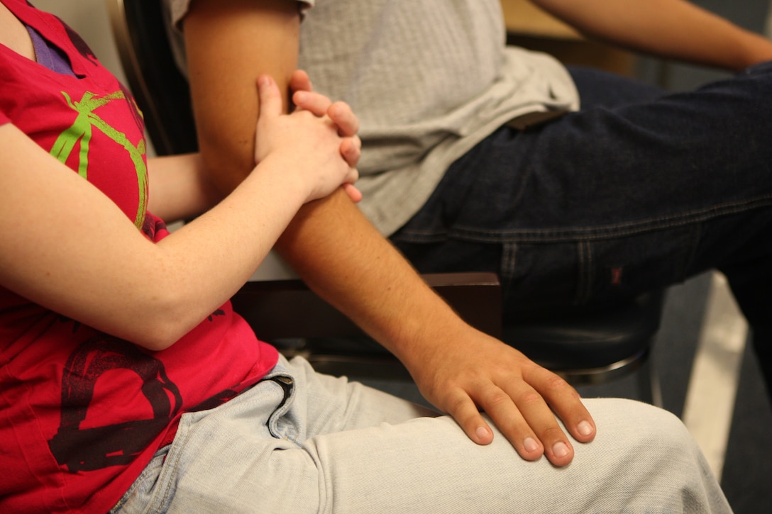 A couple attending the “Before I Do” workshop console each other at the Marine Corps Family Team Building while a lesson is being taught aboard Marine Corps Base Camp Lejeune, July 22. The workshop is a marriage enhancement program that educates couples on all aspects of marriage.