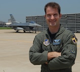 KUNSAN AIR BASE, Republic of Korea – Capt. Ryan Riley, 35th Fighter Squadron instructor pilot, poses in front of one of the squadron's F-16 Fighting Falcon aircraft. Captain Riley was recently selected to join the Air Force Thunderbirds team as Thunderbird No. 2, the left wing for the squadron. (U.S. Air Force photo/Senior Airman Roy Lynch)