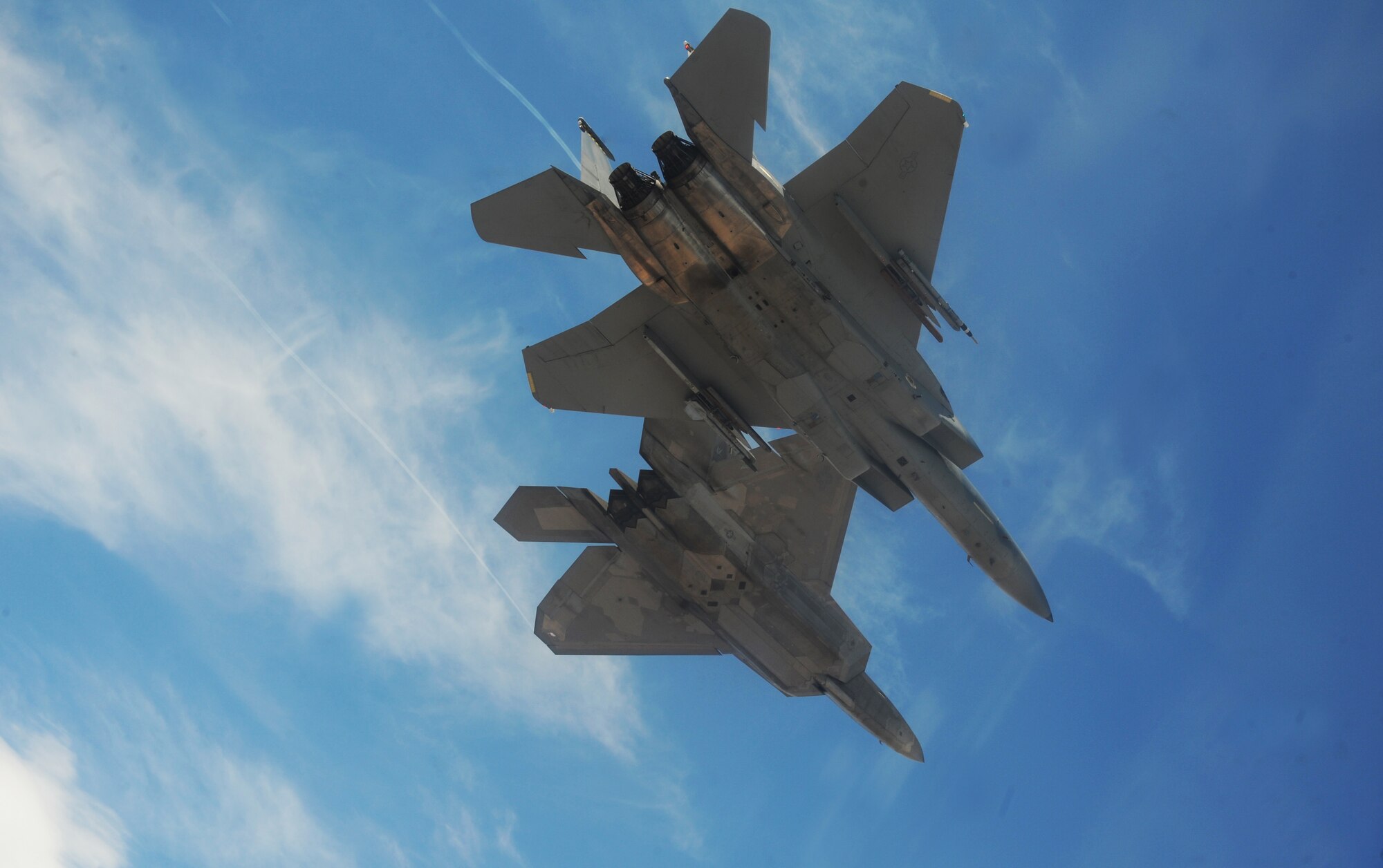 NELLIS AIR FORCE BASE, Nev.--An F-22A Raptor and F-15C Eagle from the U.S. Air Force Weapons School's 433rd Weapons Squadron fly in formation over the Nevada Test and Training Range July 16, 2010.  The NTTR is the U.S. Air Force’s premier military test and training facility with more than 12,000 square miles of airspace and 2.9 million acres of land. With 1,900 possible targets, realistic threat systems and the support of an opposing enemy force from Nellis Air Force Base, the NTTR provides the combat air force with a "peacetime battlefield" that cannot be replicated anywhere else in the world . (U.S. Air Force photo by Master Sgt. Kevin J. Gruenwald)





