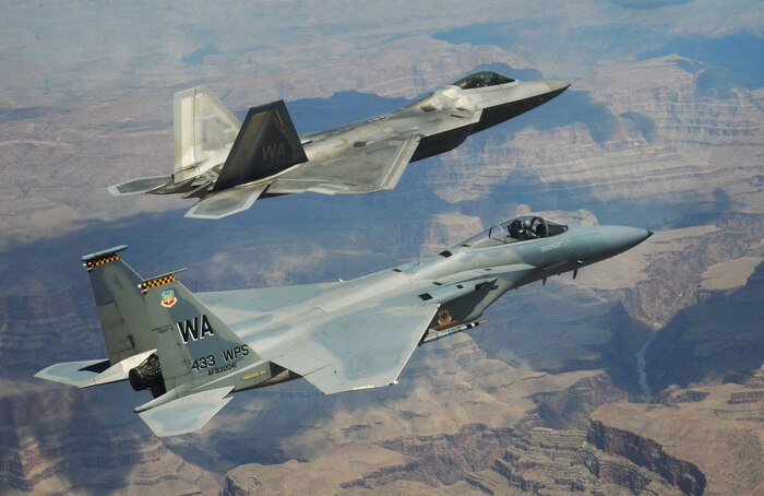 NELLIS AIR FORCE BASE, Nev.--An F-22A Raptor and F-15C Eagle from the U.S. Air Force Weapons School's 433rd Weapons Squadron fly in formation over the Grand Canyon, July 16, 2010.The Weapons School teaches graduate-level instructor courses that provide the world's most advanced training in weapons and tactics employment
(U.S. Air Force photo by Master Sgt. Kevin J. Gruenwald)

