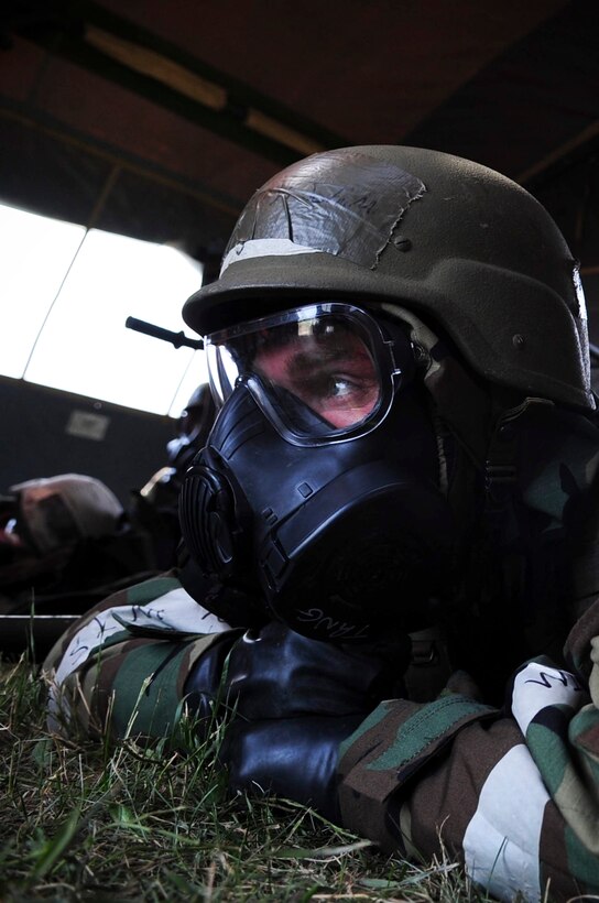 ELLSWORTH AIR FORCE BASE, S.D. – Airman 1st Class John Henry, 28th Medical Operations Squadron ambulance services technician, waits out a simulated chemical attack while in mission-oriented protective posture gear during a phase II operational readiness exercise, July 21. A phase II ORE is designed to prepare Airmen for deployed operations, including potential chemical attacks. (U.S. Air Force photo/Airman 1st Class Corey Hook)