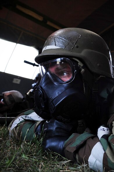 ELLSWORTH AIR FORCE BASE, S.D. – Airman 1st Class John Henry, 28th Medical Operations Squadron ambulance services technician, waits out a simulated chemical attack while in mission-oriented protective posture gear during a phase II operational readiness exercise, July 21. A phase II ORE is designed to prepare Airmen for deployed operations, including potential chemical attacks. (U.S. Air Force photo/Airman 1st Class Corey Hook)