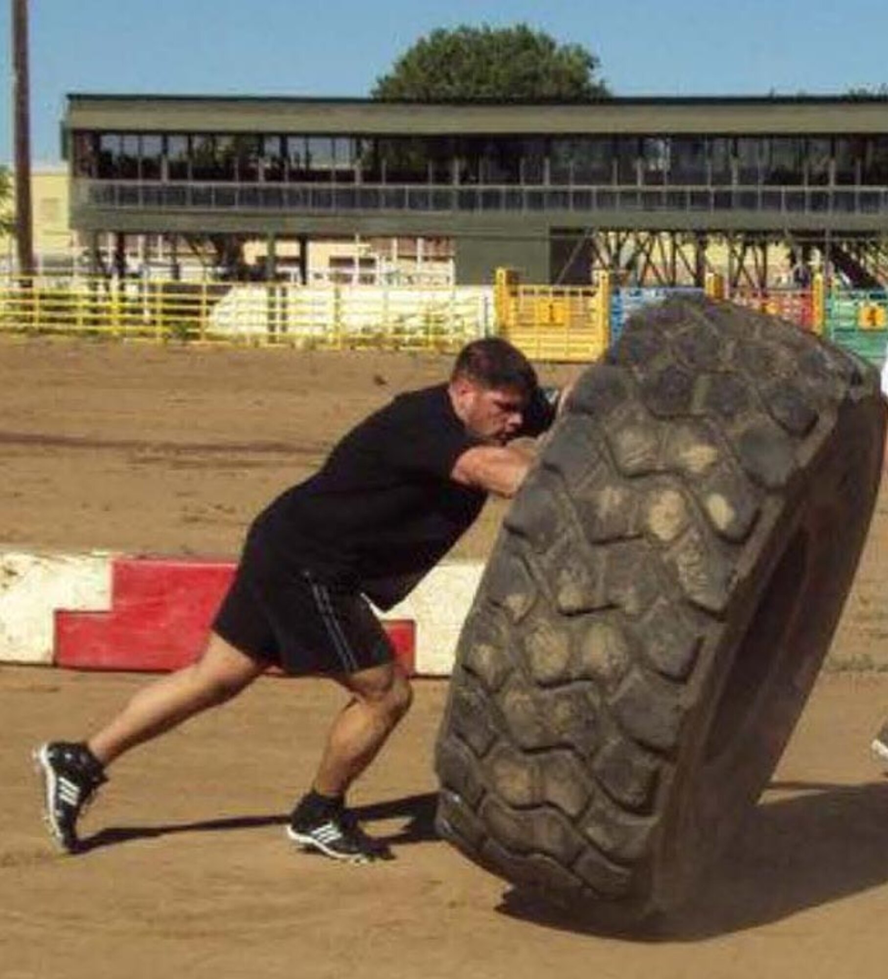 Tech Sgt. Ronald A. Strahan competes in the tire flip event at the Heritage Day Festival in Red Bluff, Calif. July 4. Sergeant Strahan won the individual event and the entire competition to qualify for the national competition in Reno, Nev. in November 2010. (Courtesy Photo)