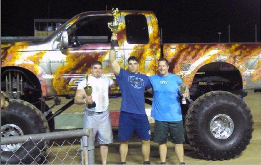 Tech Sgt. Ronald A. Strahan (middle), lifts his trophy in the air after being crowned champion of the lightweight division at the 2010 Heritage Day Festival in Red Bluff, Calif. Sergeant Strahan won several events and won the overall competition by a fraction of a point. (Courtesy Photo)