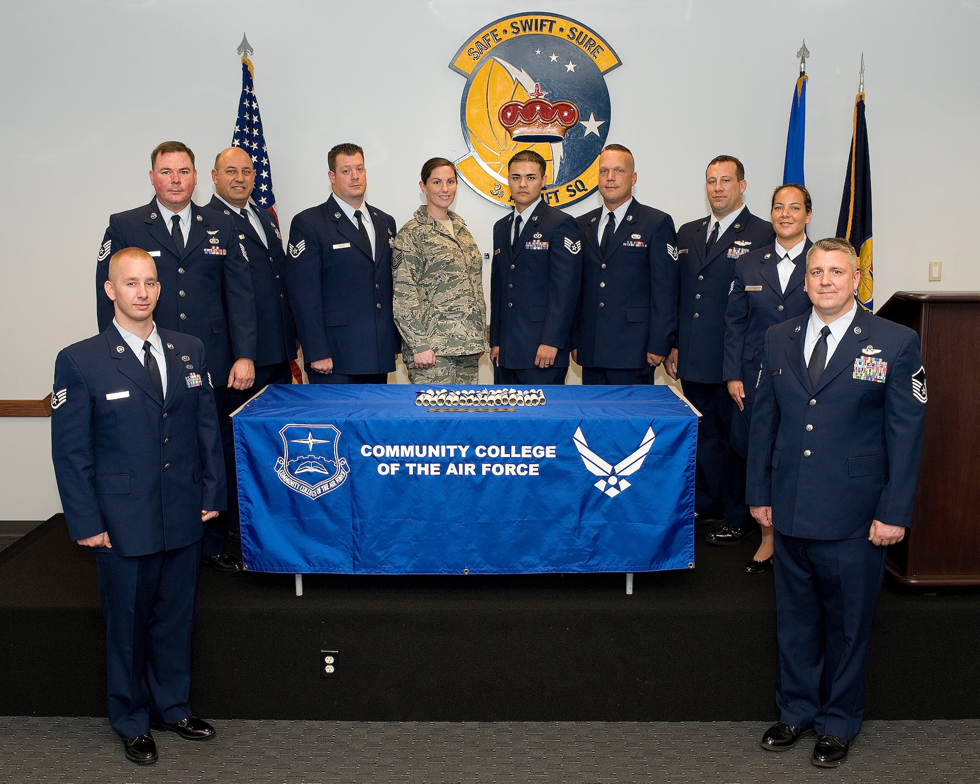 Ten Reservists from the 512th Airlift Wing earned their Community College of the Air Force degrees at a commencement during the July unit training assembly weekend in the 3rd Airlift Squadron auditorium here July 10. The CCAF is a federally-chartered degree-granting institution, which partners with 90 affiliated Air Force schools, 82 Education Service Offices located worldwide, and more than 1,500 civilian academic institutions. (U.S. Air Force photo/Jason Minto)