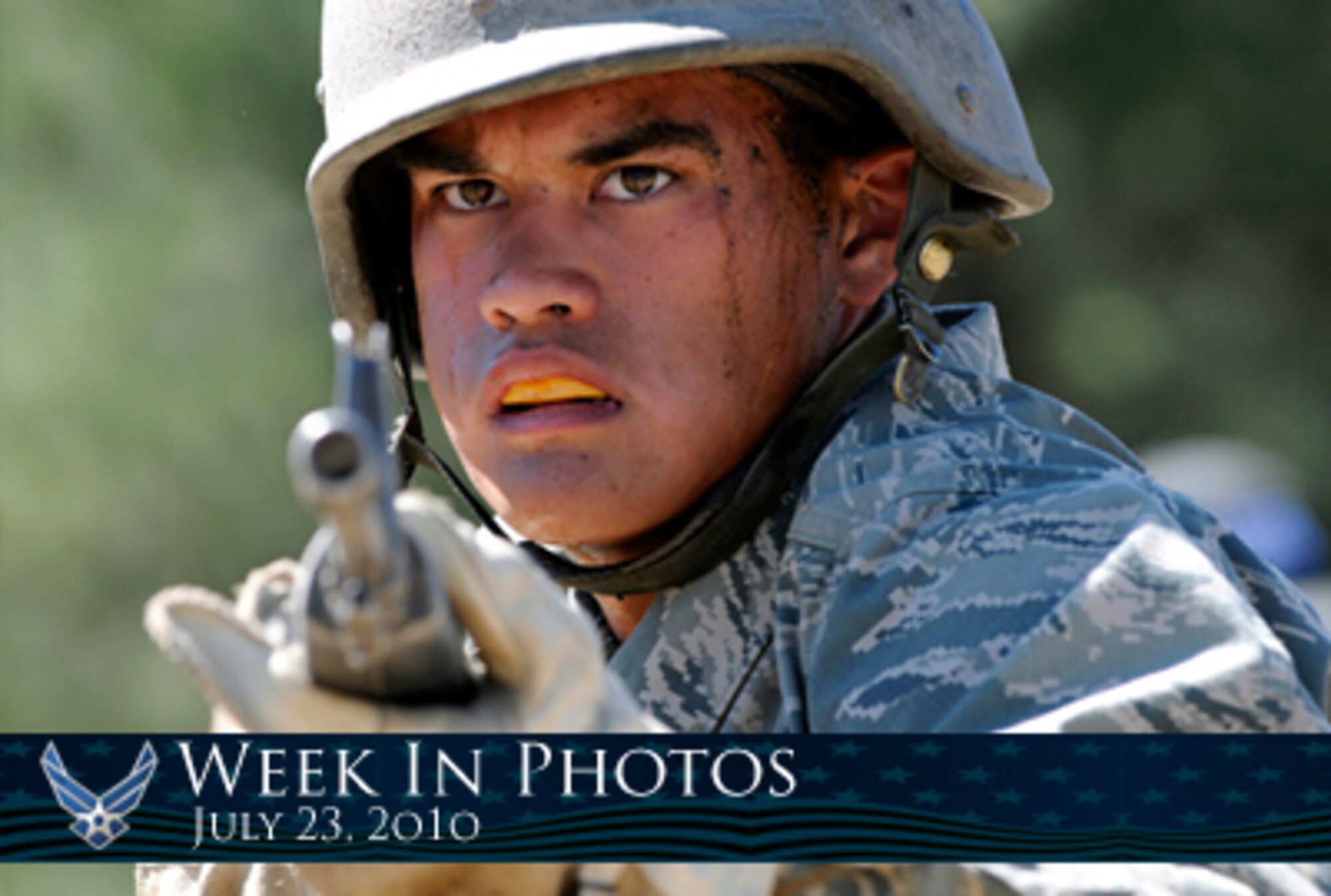 Air Force Week in Photos for July 23, 2010, highlights photos from around the Air Force. In this photo by J. Rachel Spencer, U.S. Air Force Academy Basic Cadet Ryan Mavity focuses on the instructor while learning how to handle an M-16 rifle during the second phase of Basic Cadet Training at Jacks Valley, Colo., July 16, 2010. (U. S. Air Force photo illustration/Corey Parrish)
