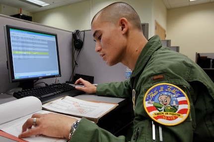 Randolph AFB, TX, 14 July 2010: Second Lieutenant  Greg Lepper, combat system officer students with class number 10-15 of the 562nd Flying Training Squadron, inputs mission data contained in a simulated intelligence file during an introduction to computerized flight planning class where students begin to prepare their own flight charts. (U.S. Air Force photo/Steve Thurow)