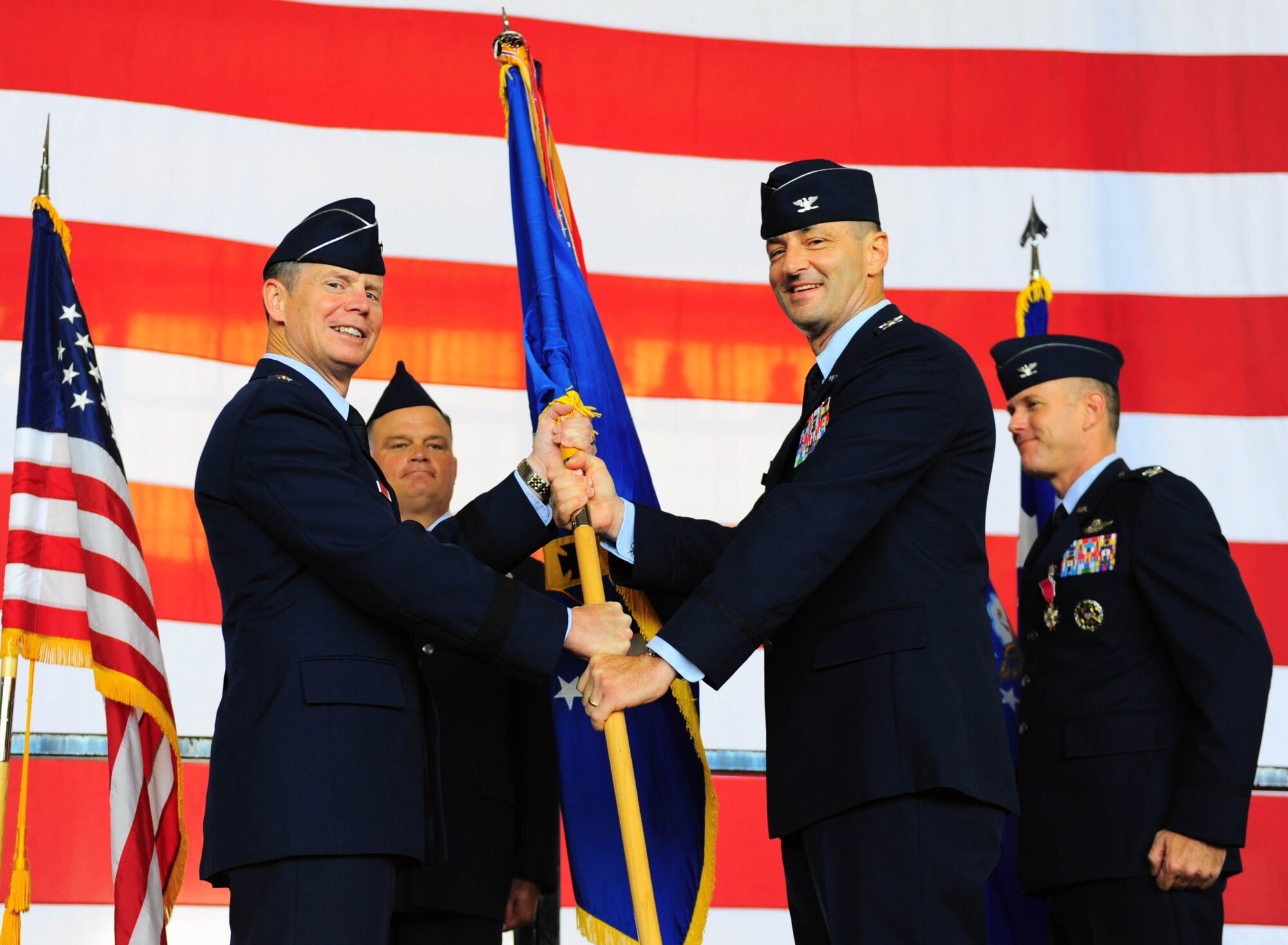 DYESS AIR FORCE BASE, Texas—Col. David Béen, incoming 7th Bomb Wing commander, takes the guidon from  12th Air Force Commander  Lt. Gen. Glenn Spears during a change of command ceremony here July 22. Colonel Béen recently served a tour of duty in Southwest Asia as the 379th Expeditionary Operations Group commander. He will be the new wing commander for the 7th Bomb Wing.  The change of command ceremony is a visible means of passing the reins of command from the departing commander to the new commander.  (U.S. Air Force photo/ Senior Airman Domonique Washington)