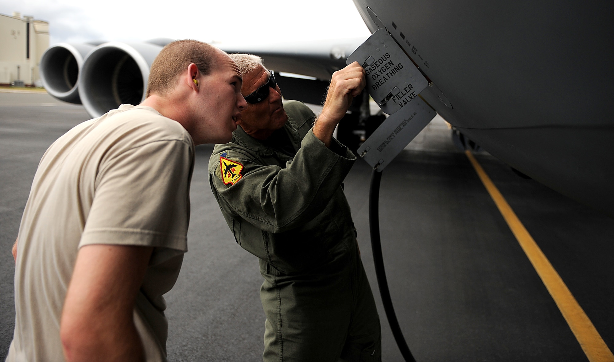 KC-135 Stratotanker Aircraft Commander Lt. Col. Eric Wilks with the 465th Air Refueling Squadron, Tinker AFB, Oklahoma walks around his plane conducting a pre-flight inspection before flying a refueling mission on July 8, 2010 in support of RIMPAC 2010 at Hickam AFB, Hawaii. RIMPAC 2010 is the 22nd in a series of significant international multilateral combined/joint military exercises scheduled biennially by U.S. Pacific Fleet and takes place here in the Hawaiian operating area. RIMPAC includes more than 14 nations, 34 ships, five submarines, more than 100 aircraft and more than 20,000 Soldiers, Sailors, Marines and Airman. RIMPAC enhances cooperation between partnering nations and practices our ability to plan, communicate, and execute operations. (U.S. Air Force photo by: MSgt Jeremy Lock) (Released)
