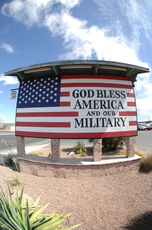 Airmen from the 372nd Training Squadron, Detachment 13, came together to restore the American flag sign in front of Davis Concrete Construction on Nellis Boulevard June 30. The Airmen repainted the sign to get rid of graffiti, improve community relations and show respect and proper display of the flag. (U.S. Air Force photo by Airman 1st Class Cynthia A. Haughton)