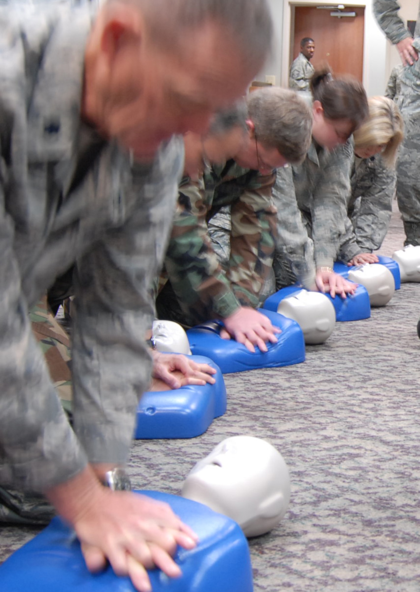 Missouri Air National Guard members get Cardiopulmonary Resuscitation (CPR) training during a recent unit training assembly drill at Scott Air Force Base. Courses like self-aid and buddy care help Airmen survive alone, or take care of others injured during deployment. SABC also prepares them to take care of someone in the community like friends, family and co-workers. (U.S. Air Force photo/Maj. Stan Paregien)