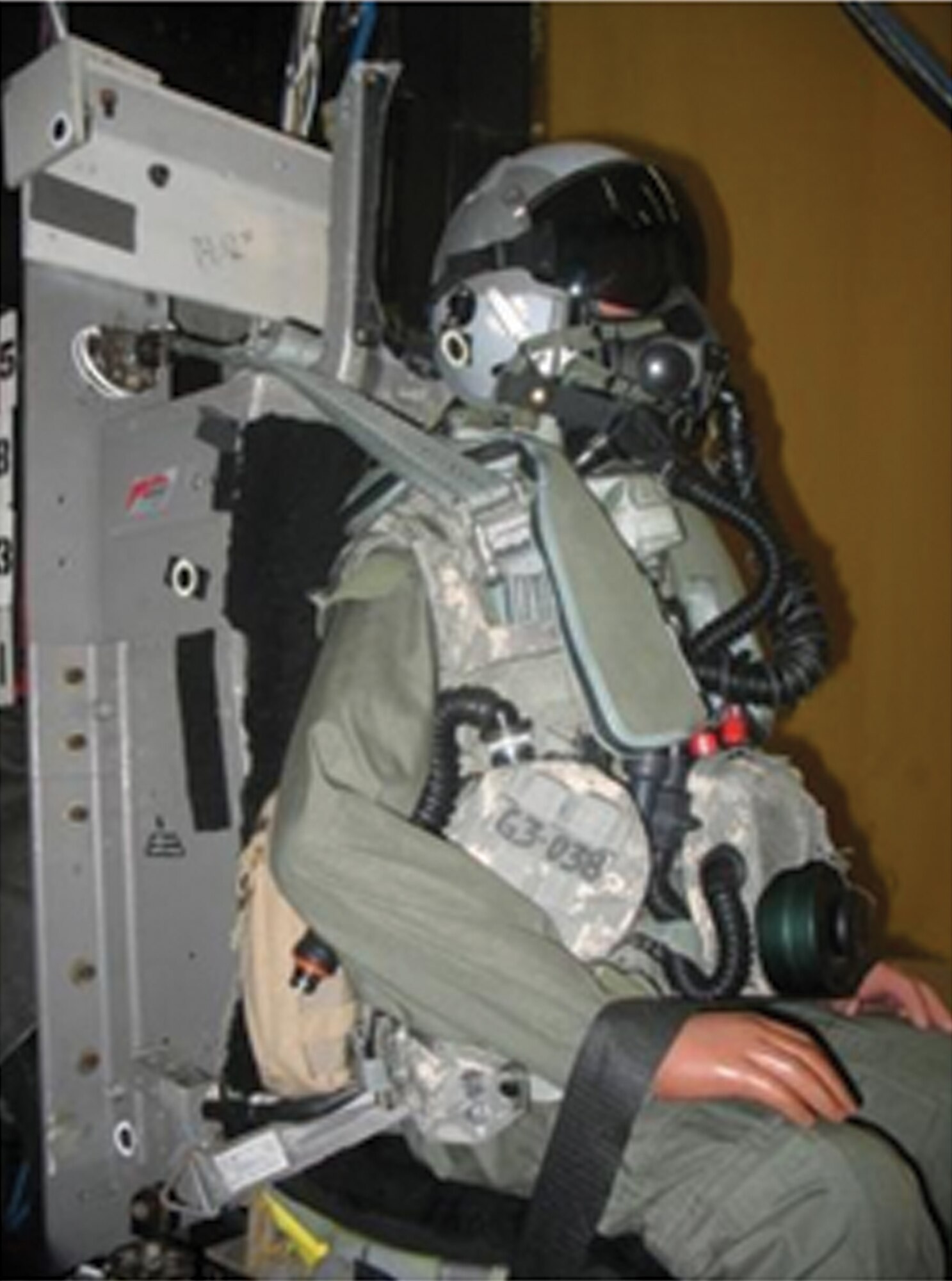 A manikin fitted with a Joint Service Aircrew Mask and Joint Helmet-Mounted Cueing System facilitates AFRL's recent biodynamic evaluation of the protective equipment in terms of pilot neck loads. (Air Force image)