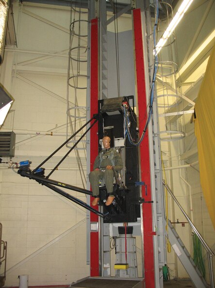 A manikin fitted with a Joint Service Aircrew Mask and Joint Helmet-Mounted Cueing System facilitates AFRL's recent biodynamic evaluation of the protective equipment in terms of pilot neck loads. (Air Force image)