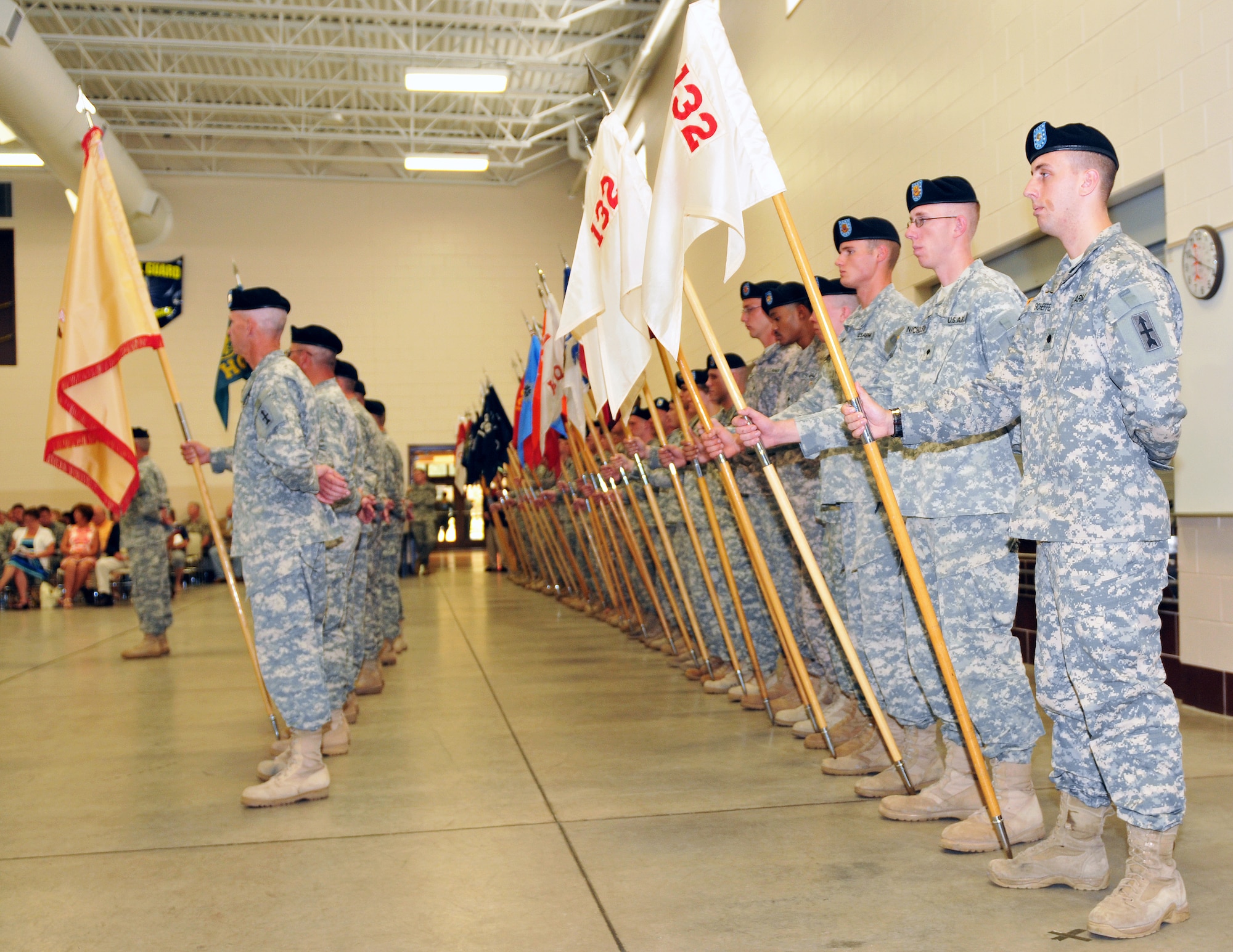 Soldiers of the 32nd Infantry Brigade Combat Team stand in formation during a change-of-commander ceremony at Camp Williams July 10. Col. Martin Seifer took command from Col. Steven Bensend and Command Sgt. Maj. Rafael Conde assumed the senior enlisted position from Command Sgt. Maj. Ed Hansen. Wisconsin National Guard photo by Tech. Sgt. Jon LaDue