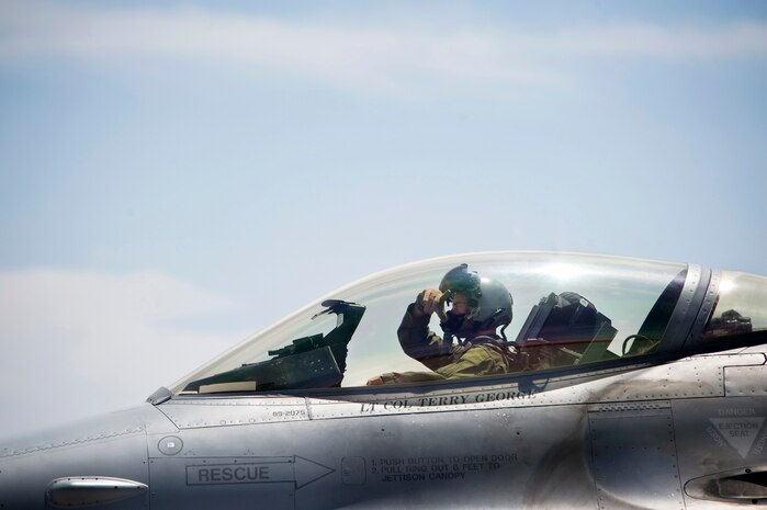 NELLIS AIR FORCE BASE, Nev.-- Capt. Phil Jackson, an F-16 pilot, 4th Fighter Wing, Hill Air Force Base prepares to taxi his F-16 taxi his aircraft for a Green Flag-West 10-8 mission at Nellis on July 20, 2010.  Members from the his 4th Fighter Squadron are training with the U.S. Army in realistic air-land integration scenarios at the National Training Center, Fort Irwin, Calif., July 11-23. The 4th FS is preparing for upcoming deployment to Afghanistan in in support of counter-insurgency operations. (U.S. Air Force photo by Lawrence Crespo)
