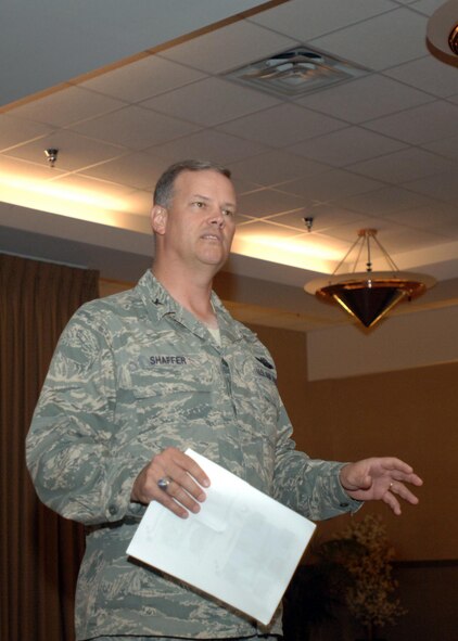 Col. Don Shaffer, 319th Air Refueling Wing commander, briefs the upcoming changes facing the base during the wing's Civic Leaders Tour. This annual event gives civic, business and government leaders from Grand Forks the opportunity to come tour the base, meet with senior military officials and see the facilities. It also facilitates discussion between the base and the community on the future of the base as it transitions from tankers to unmanned aerial systems. (U.S. Air Force photo/Tech. Sgt. Joseph Kapinos)