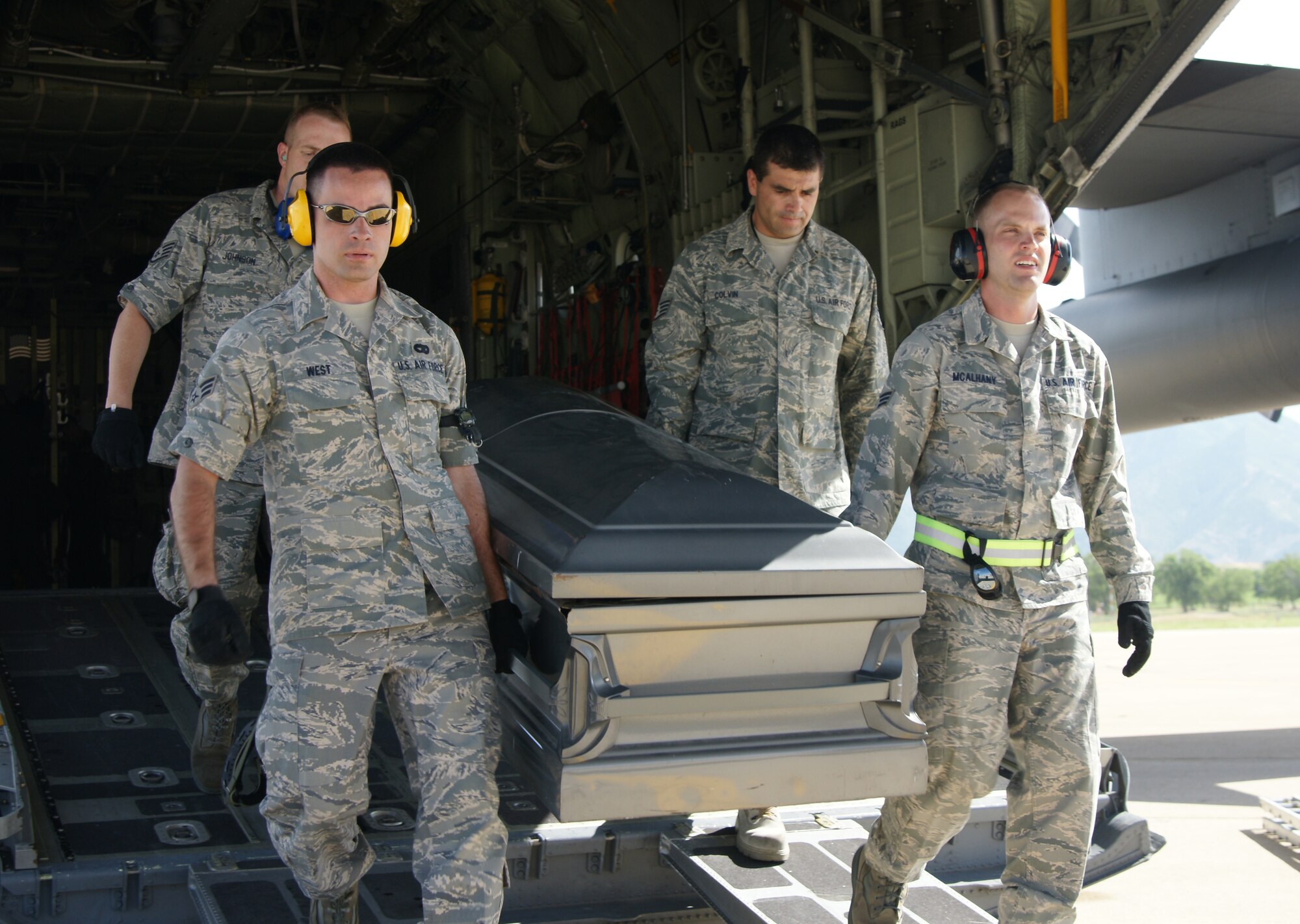 Members of the 67th Aerial Port Squadron practice the reverent protocol for transporting human remains. (U.S. Air Force photo/Staff Sgt. Alan Schultz)