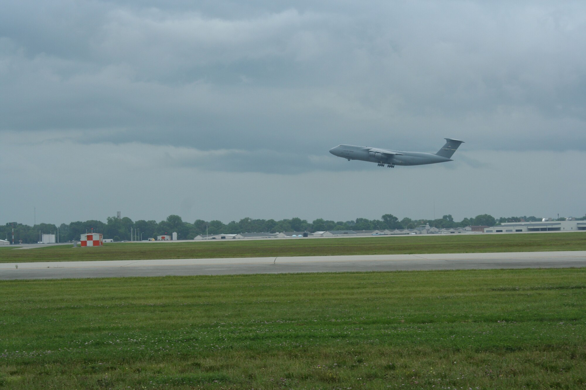 WRIGHT-PATTERSON AIR FORCE BASE, Ohio – A 445th Airlift Wing C-5 Galaxy takes off on a mission on a warm, summer day in July.  The C-5 is the largest aircraft in the Air Force inventory. (U.S. Air Force photo/Senior Airman Robert Nelson)