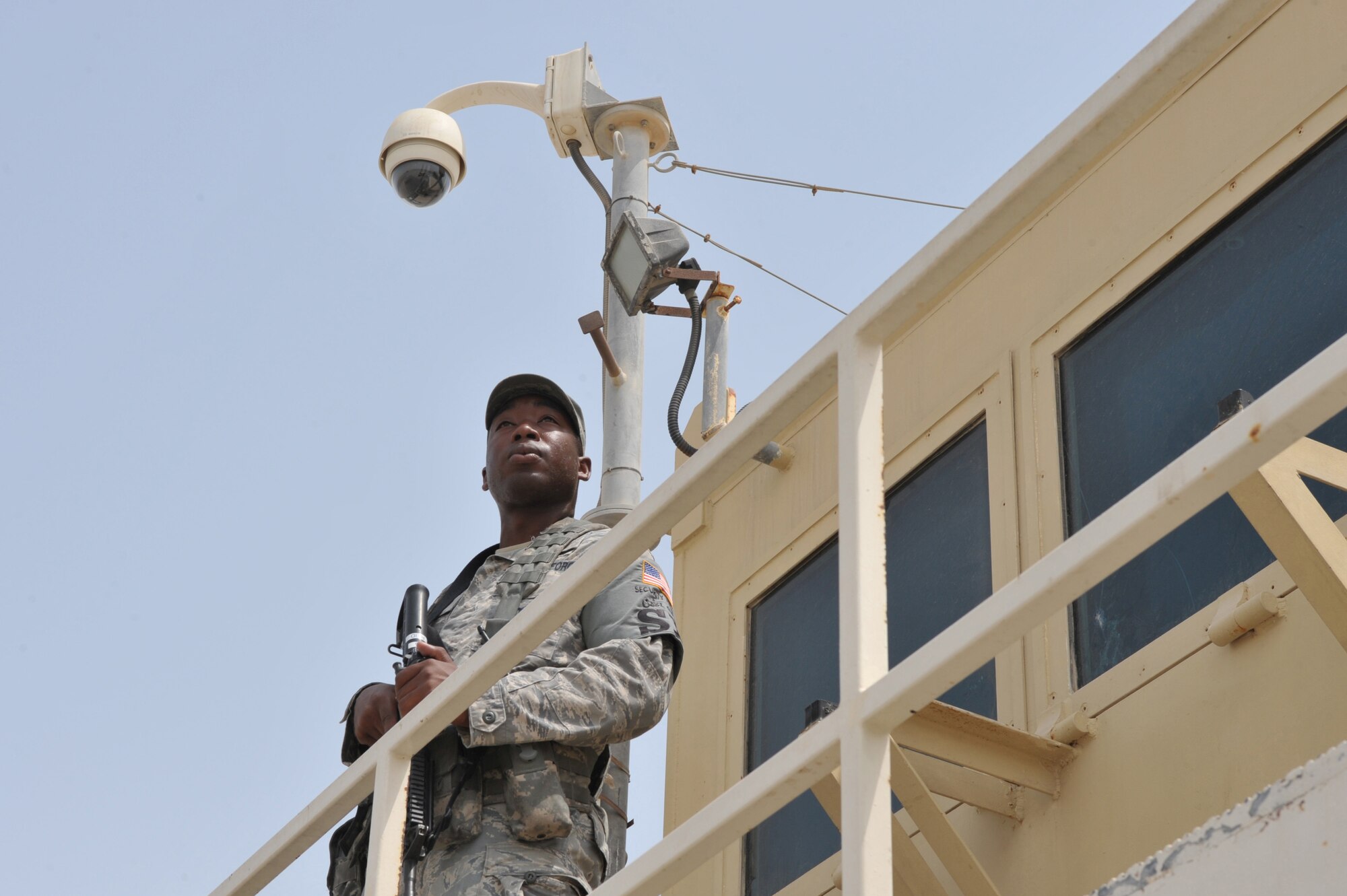 A 380th Expeditionary Security Forces Airman watches over the flightline July 22 at an undisclosed location in Southwest Asia.  Security Forces Airmen are responsible for securing more than 300 acres of land.  (U.S. Air Force photo/Tech. Sgt. April Wickes)