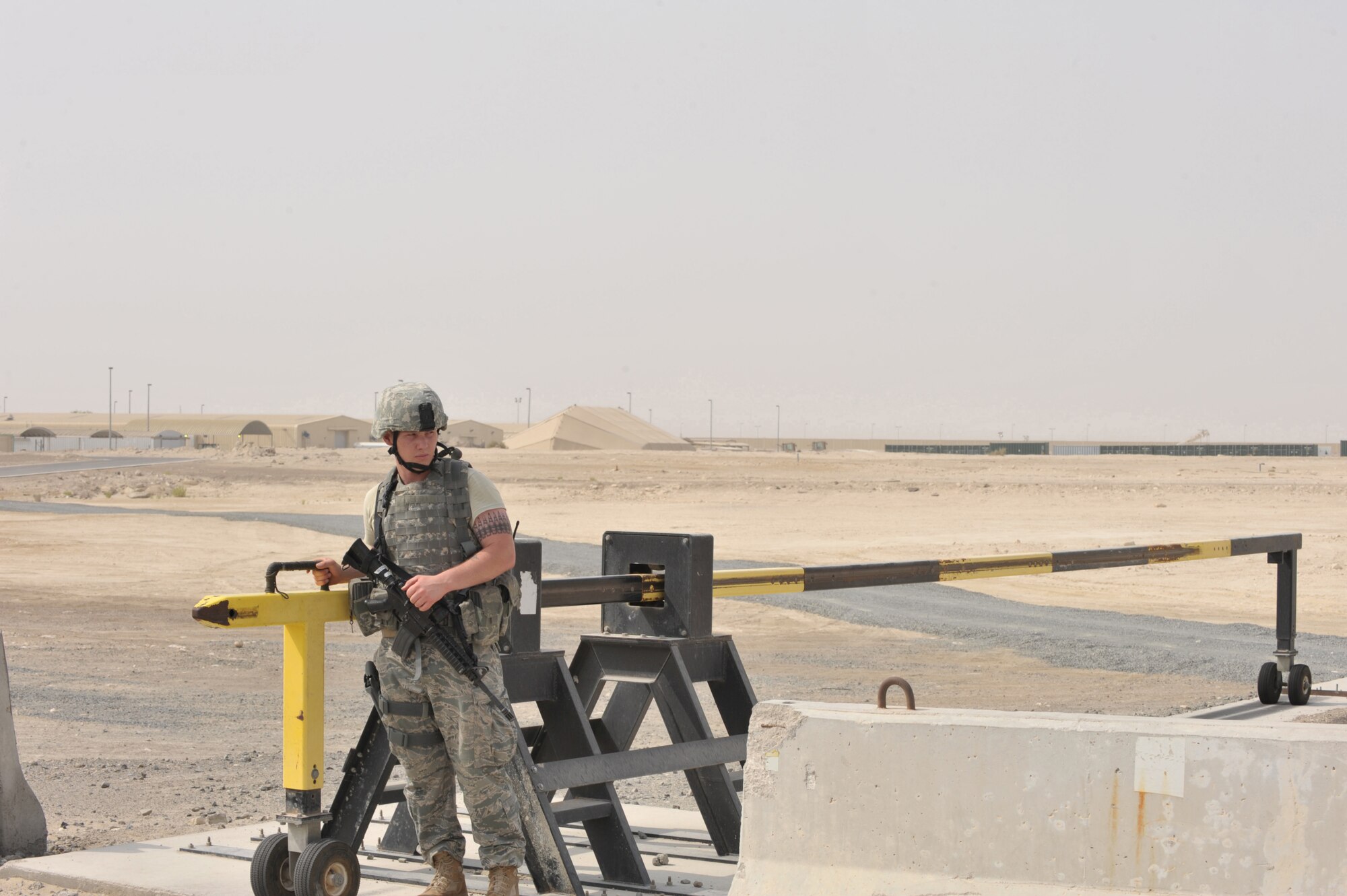 A 380th Expeditionary Security Forces Airman operates a security checkpoint July 22 at an undisclosed location in Southwest Asia.  Security Forces Airmen are responsible for securing more than 300 acres of land.  (U.S. Air Force photo/Tech. Sgt. April Wickes)