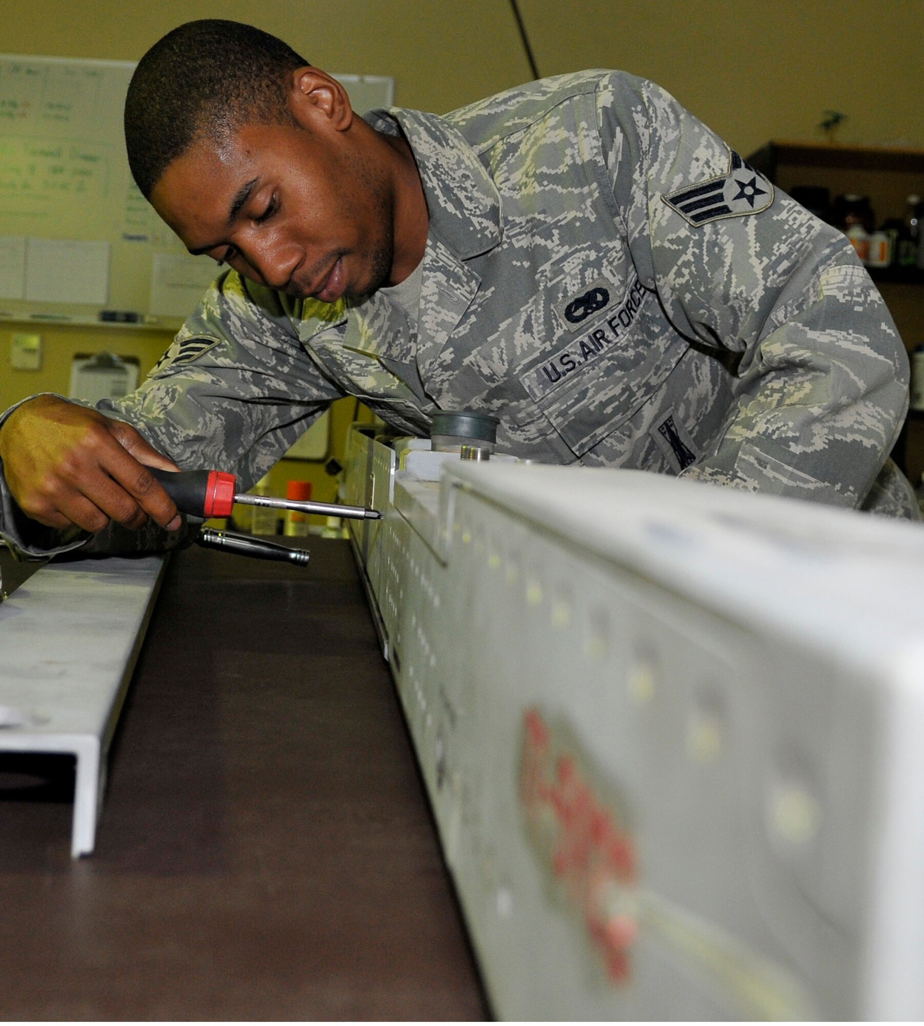 Senior Airman David Barnett, 332nd Expeditionary Maintenance Squadron aircraft armament technician, disassembles a launcher for repairs July 17, 2010, Joint base Balad, Iraq. The launch assist unit supports the firing of the AIM-120 advanced medium-range air-to-air missile and the AIM-9 Sidewinder missile on the F-16 Fighting Falcon. Airman Barnett is a native of Atlanta, Ga., deployed from Shaw Air Force Base, S.C. (Air Force photo/Staff Sgt. Phillip Butterfield)